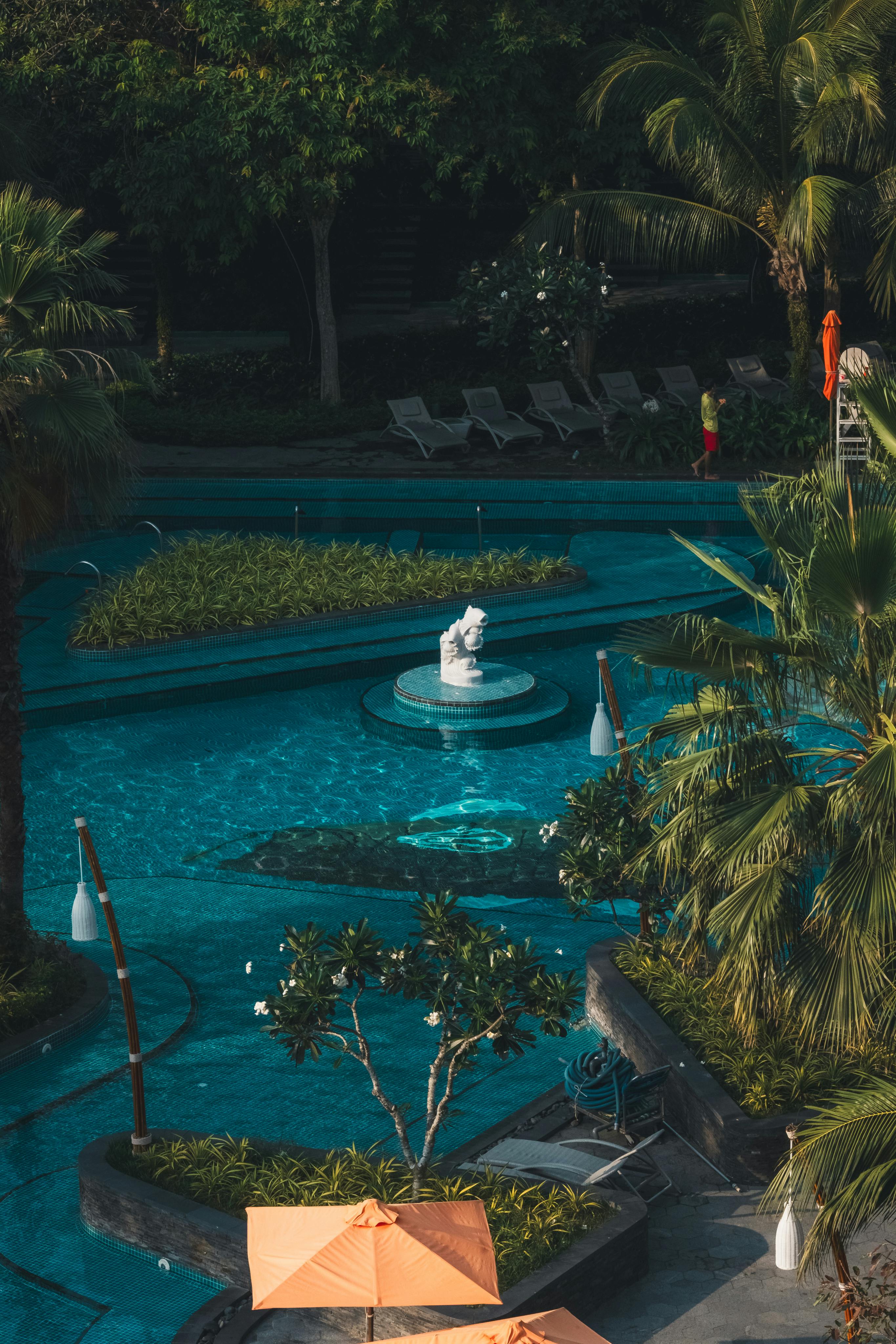 Poolside view surrounded by tropical greenery at a Resorts World Sentosa hotel on Sentosa Island Singapore