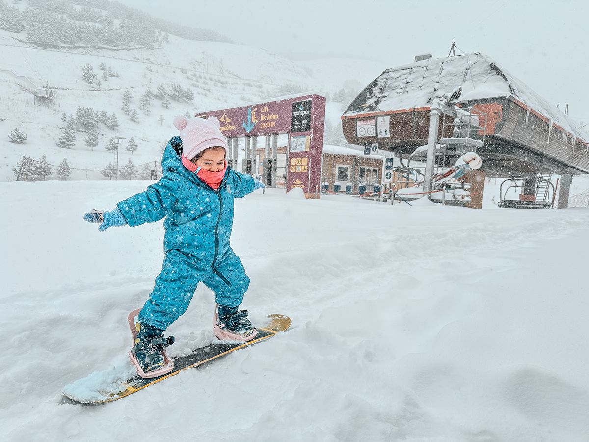Ski instructor with toddler