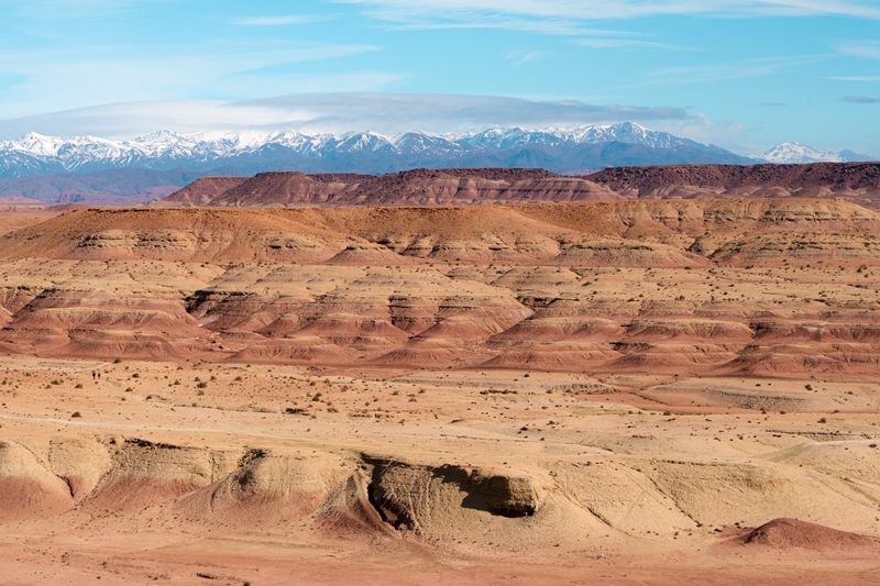 Snow capped Atlas mountains Morocco desert