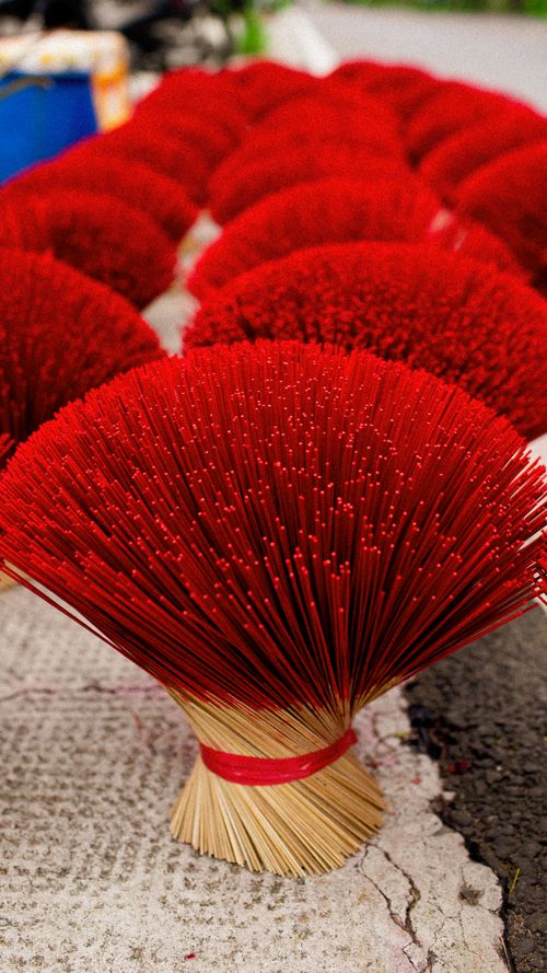 Free Vibrant red incense sticks drying outdoors in Ho Chi Minh City, showcasing Vietnamese culture. Stock Photo