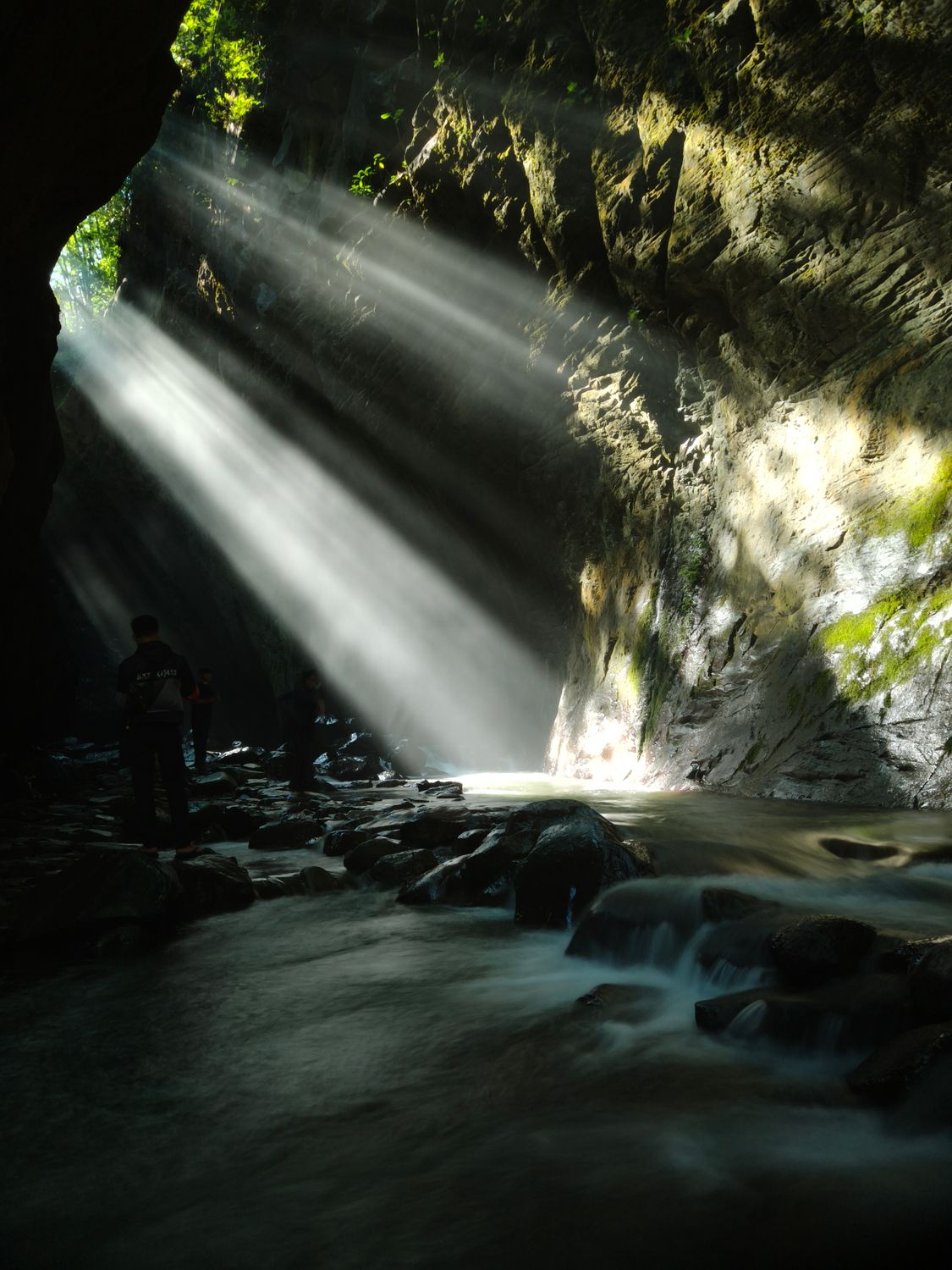 Sun Rays Illuminate Waterfall in West Java Cave · Free Stock Photo