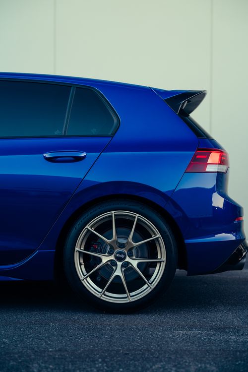 Free Close-up of a blue car's rear section showcasing modern design and alloy rims. Stock Photo