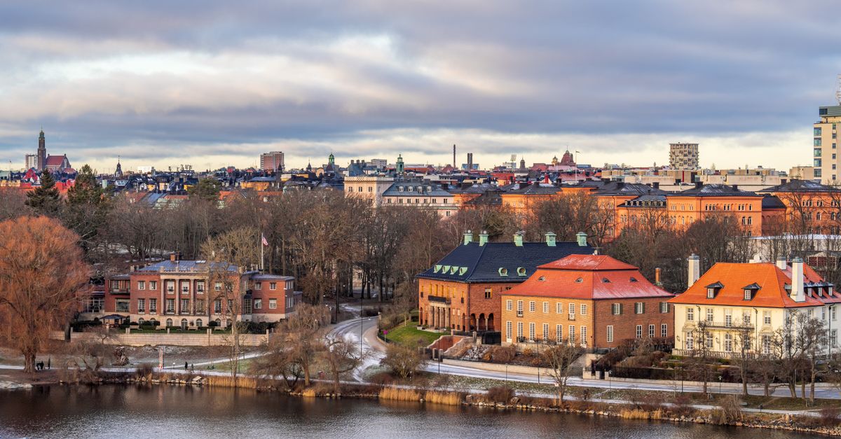 Charming winter view of Stockholm's historic waterfront architecture under an overcast sky, Sweden.