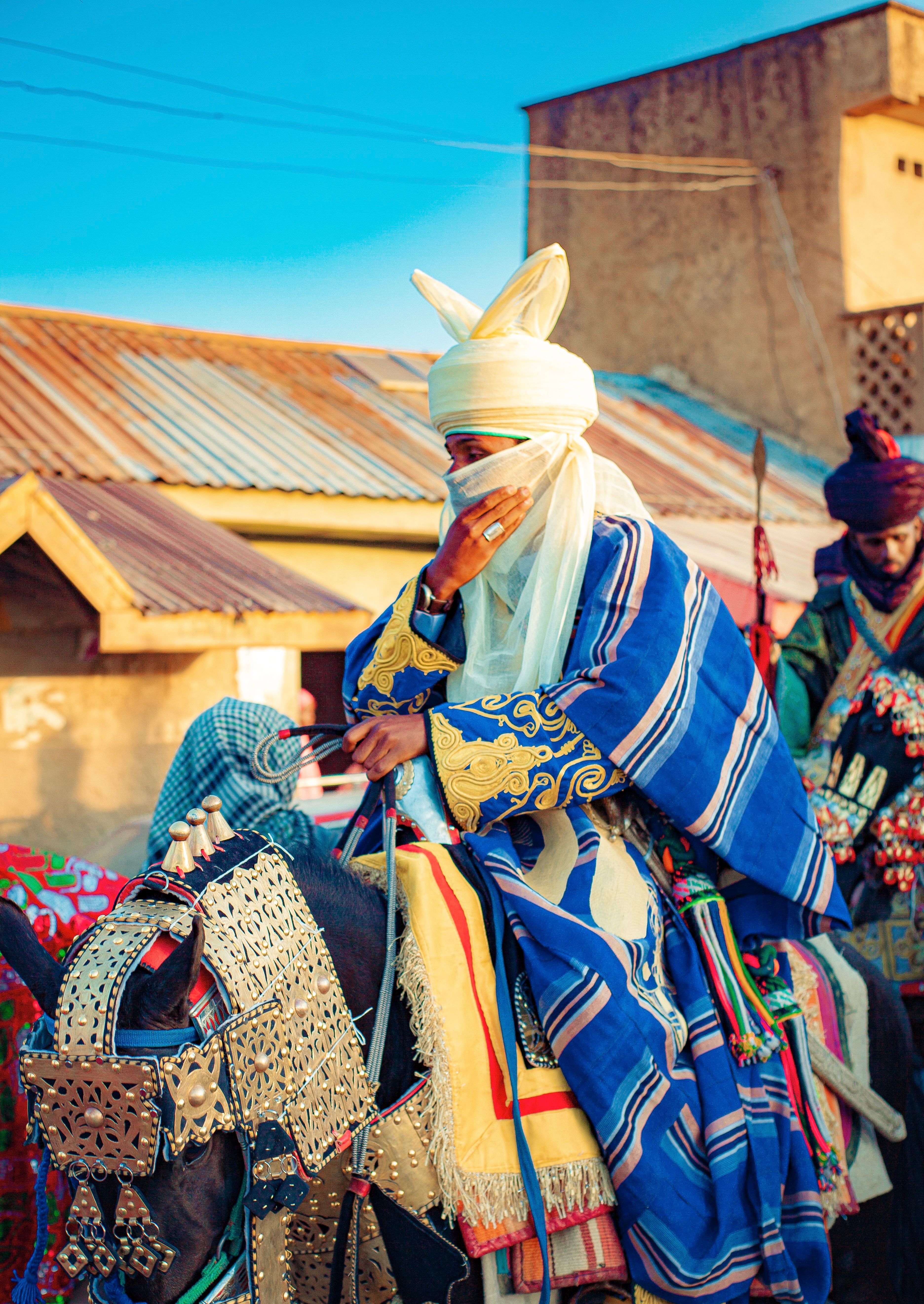 Traditional African Horseback Riders in Colorful Attire · Free Stock Photo