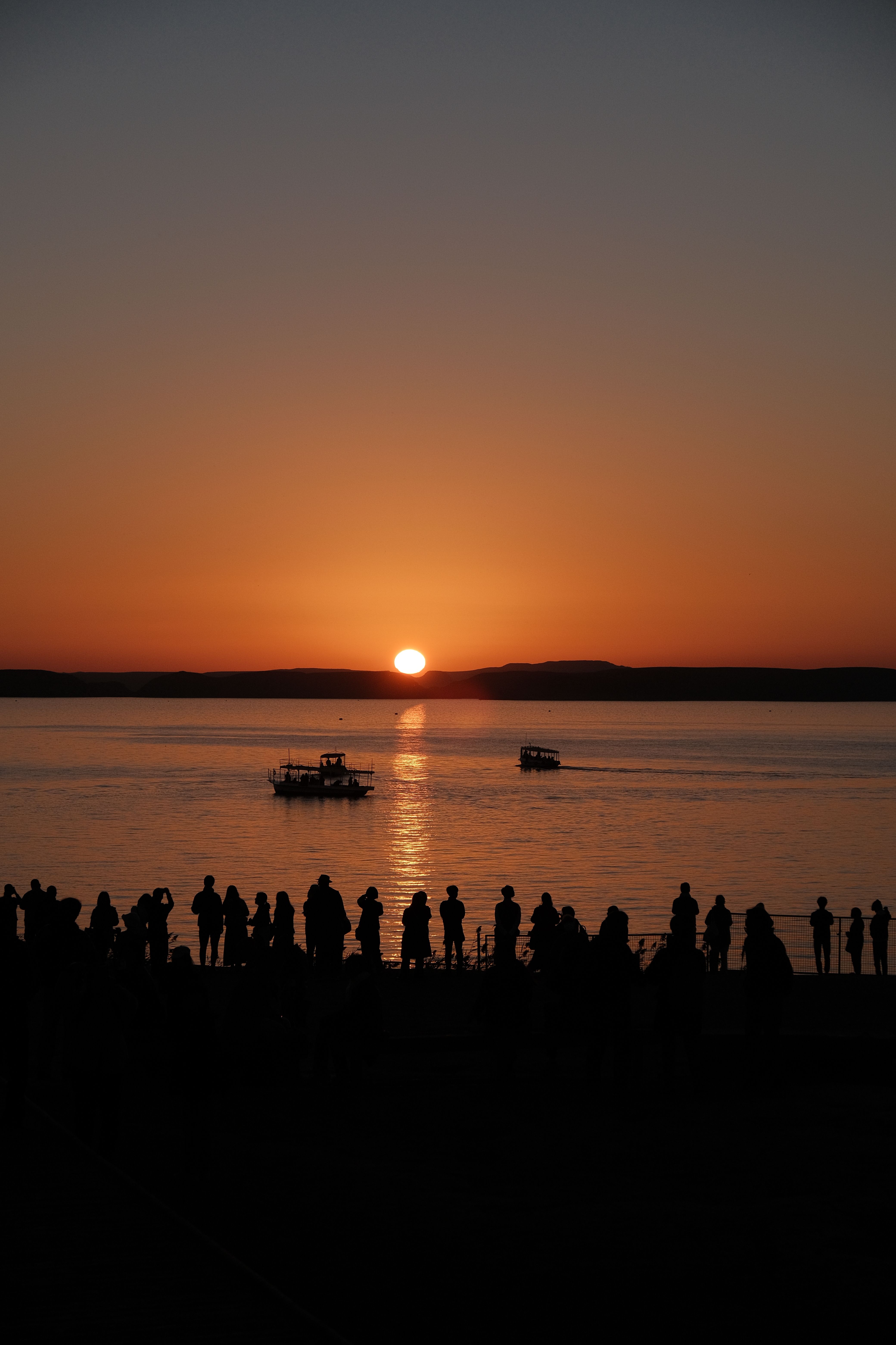 Silhouette of Crowd Watching Sunset by the Lake · Free Stock Photo