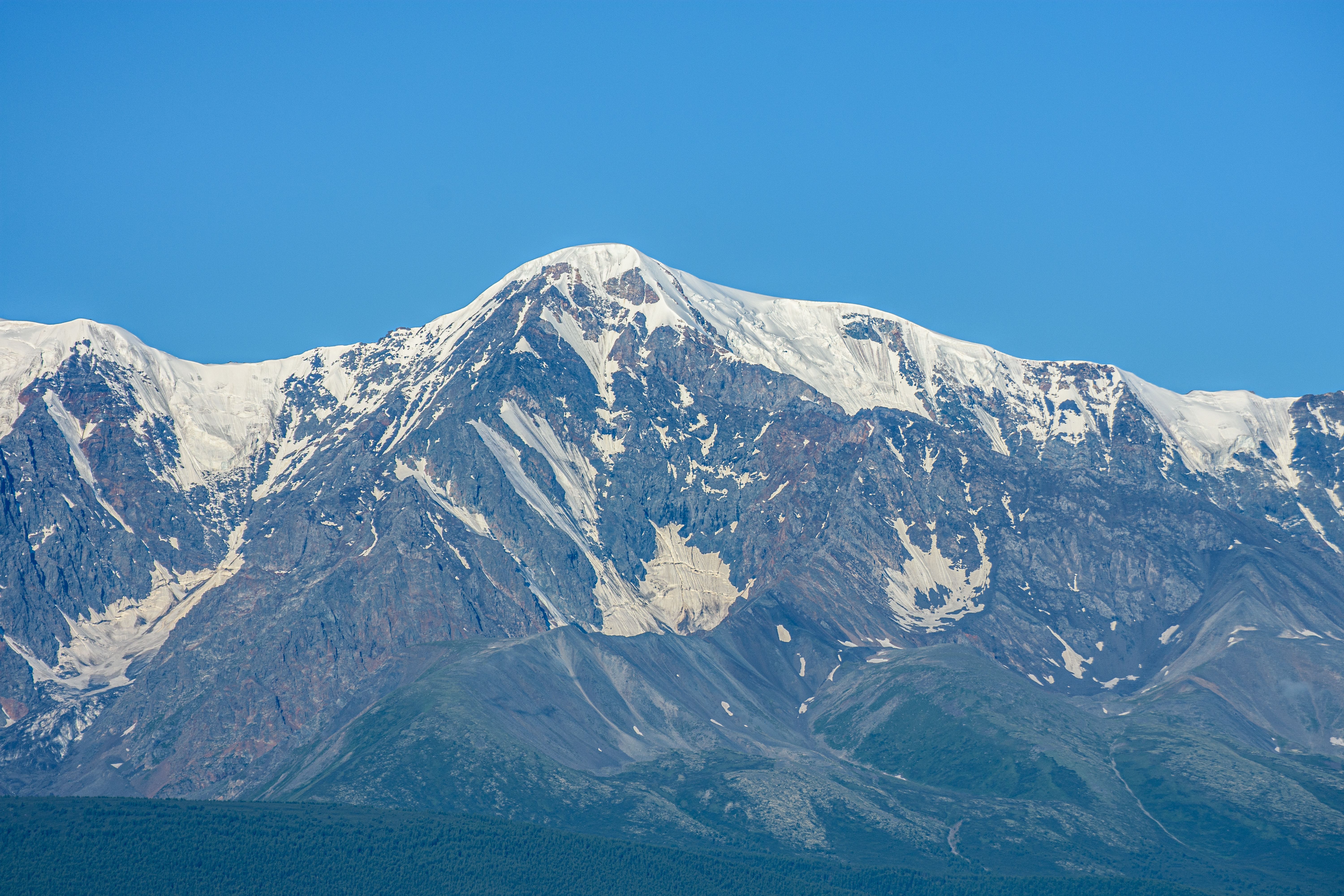 Majestic Snow-Capped Mountain Under Clear Blue Sky · Free Stock Photo