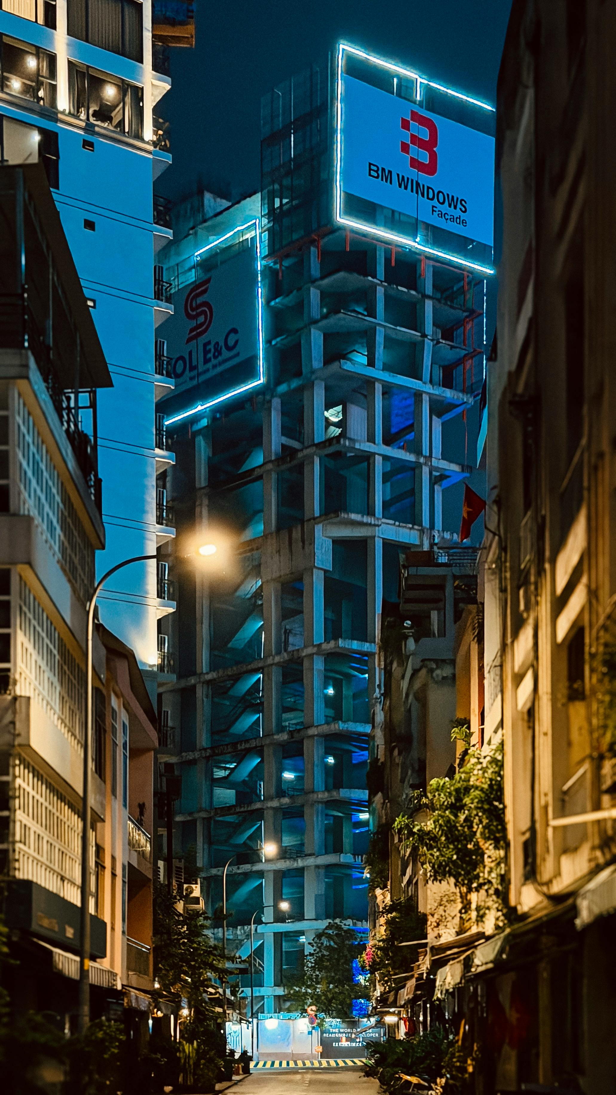A night scene of modern architecture and street view in Ho Chi Minh City, Vietnam.
