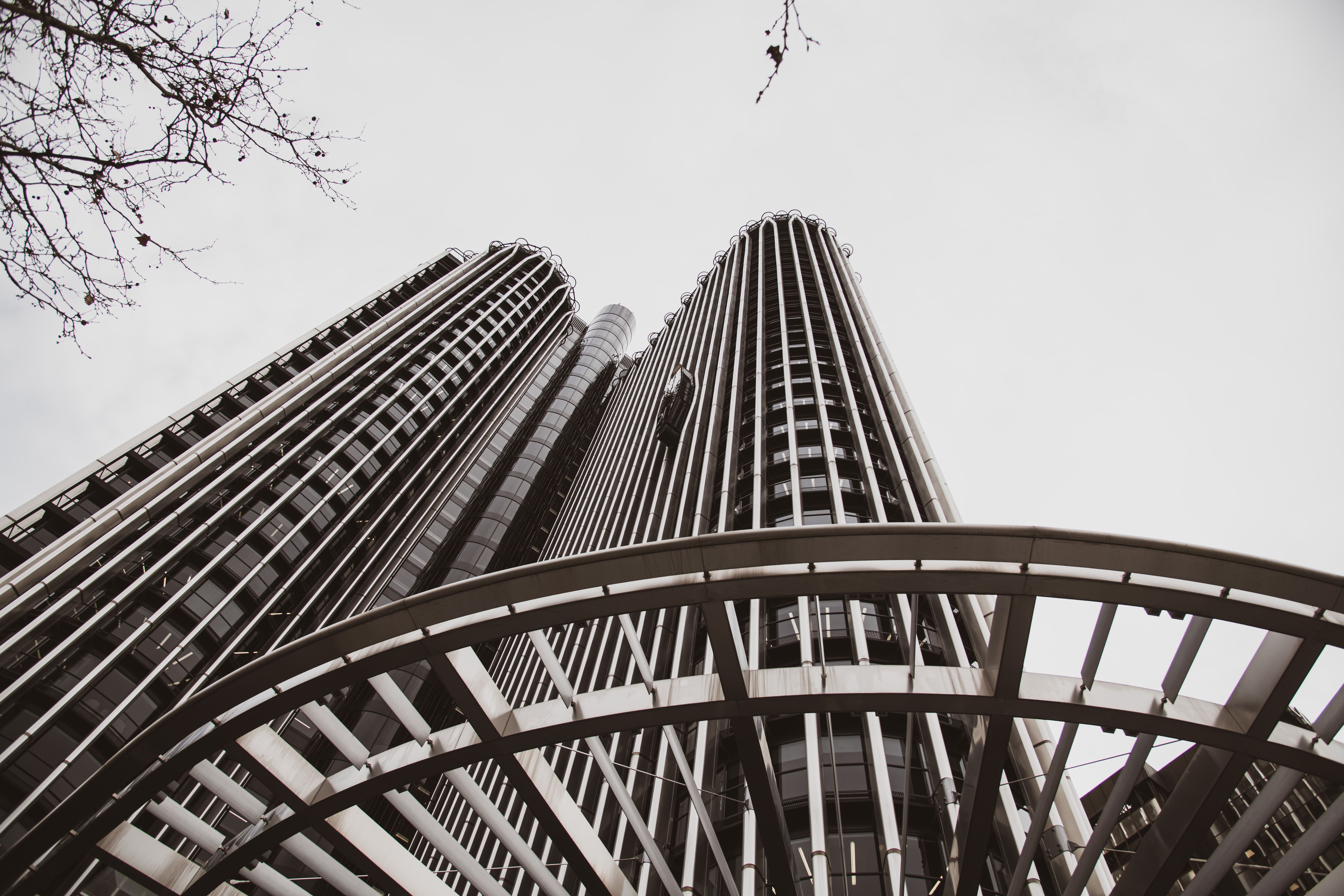 Urban architecture with towering skyscrapers viewed from below in Madrid.