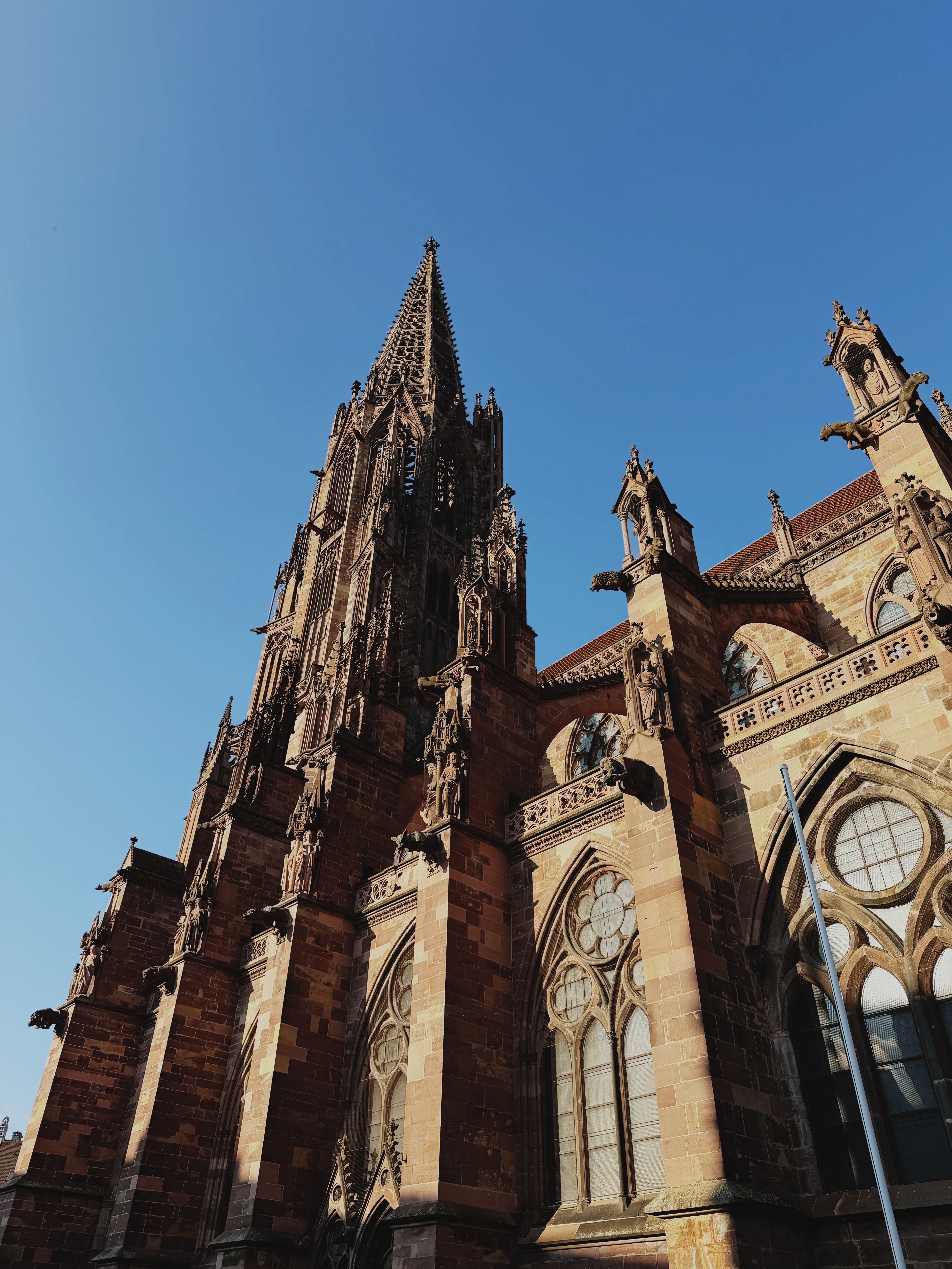 Majestic Gothic Cathedral Against Clear Blue Sky · Free Stock Photo