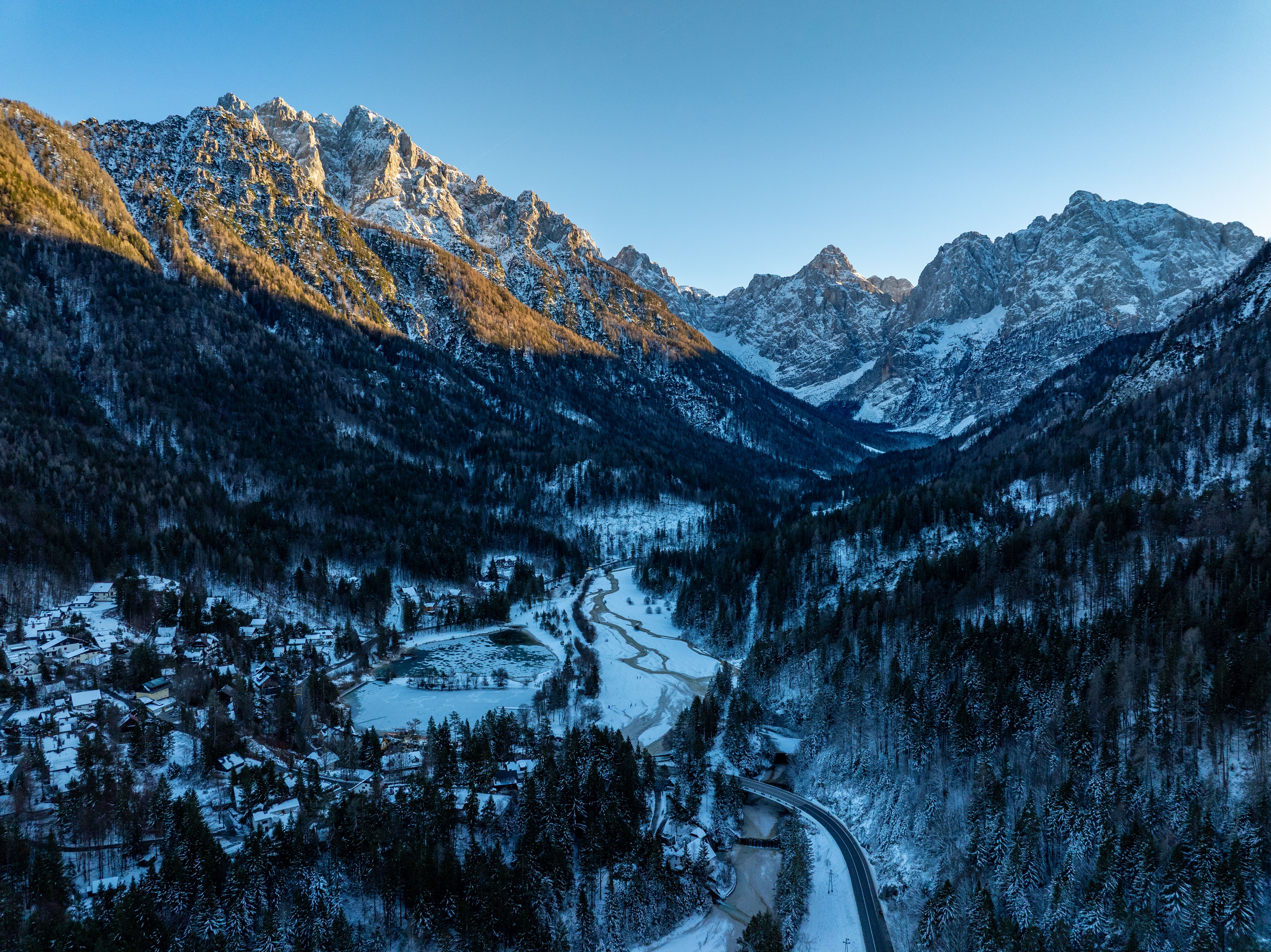 Stunning aerial view of snow-covered Kranjska Gora mountains during winter.