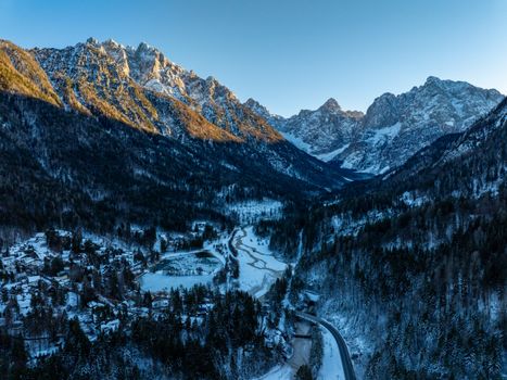 Stunning aerial view of snow-covered Kranjska Gora mountains during winter.