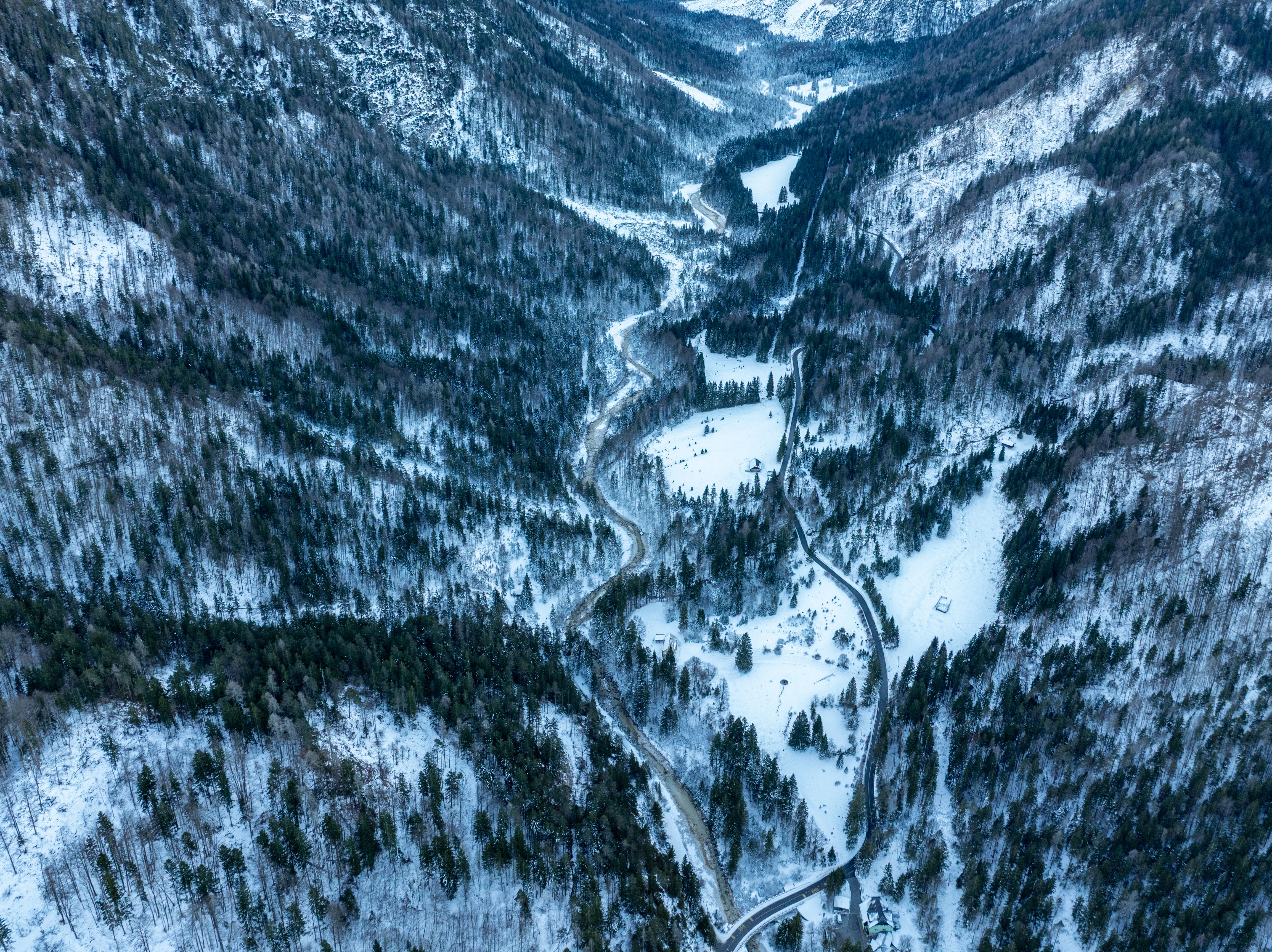A road winding along the floor of a snow-covered valley at Kranjska Gora