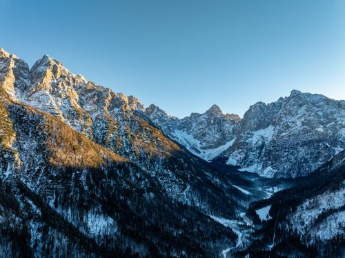 Free Breathtaking winter sunrise over the Julian Alps, showcasing snow-covered peaks in Kranjska Gora, Slovenia. Stock Photo