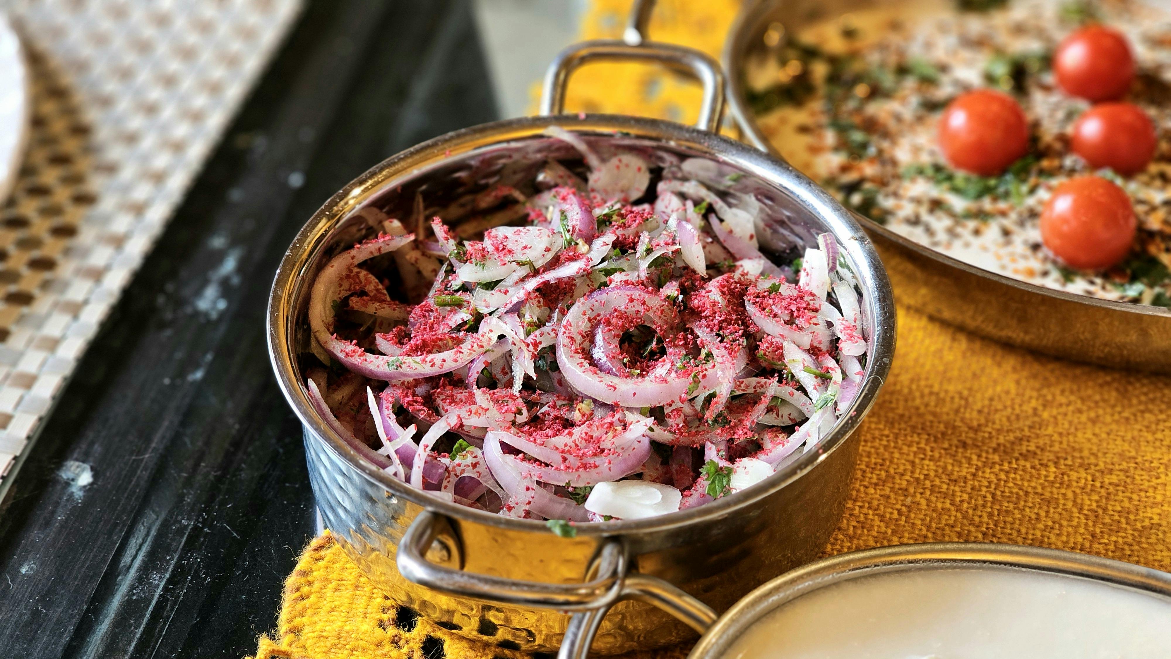 Sumac Spice On A Wooden Table With Middle Eastern Dishes