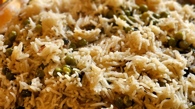 Close-up of flavorful basmati rice mixed with green peas, ideal for culinary websites.