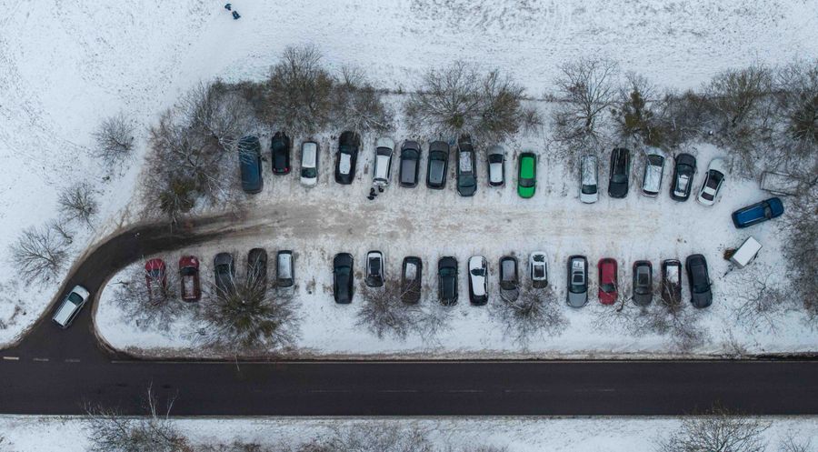 Snow-covered commercial parking lot