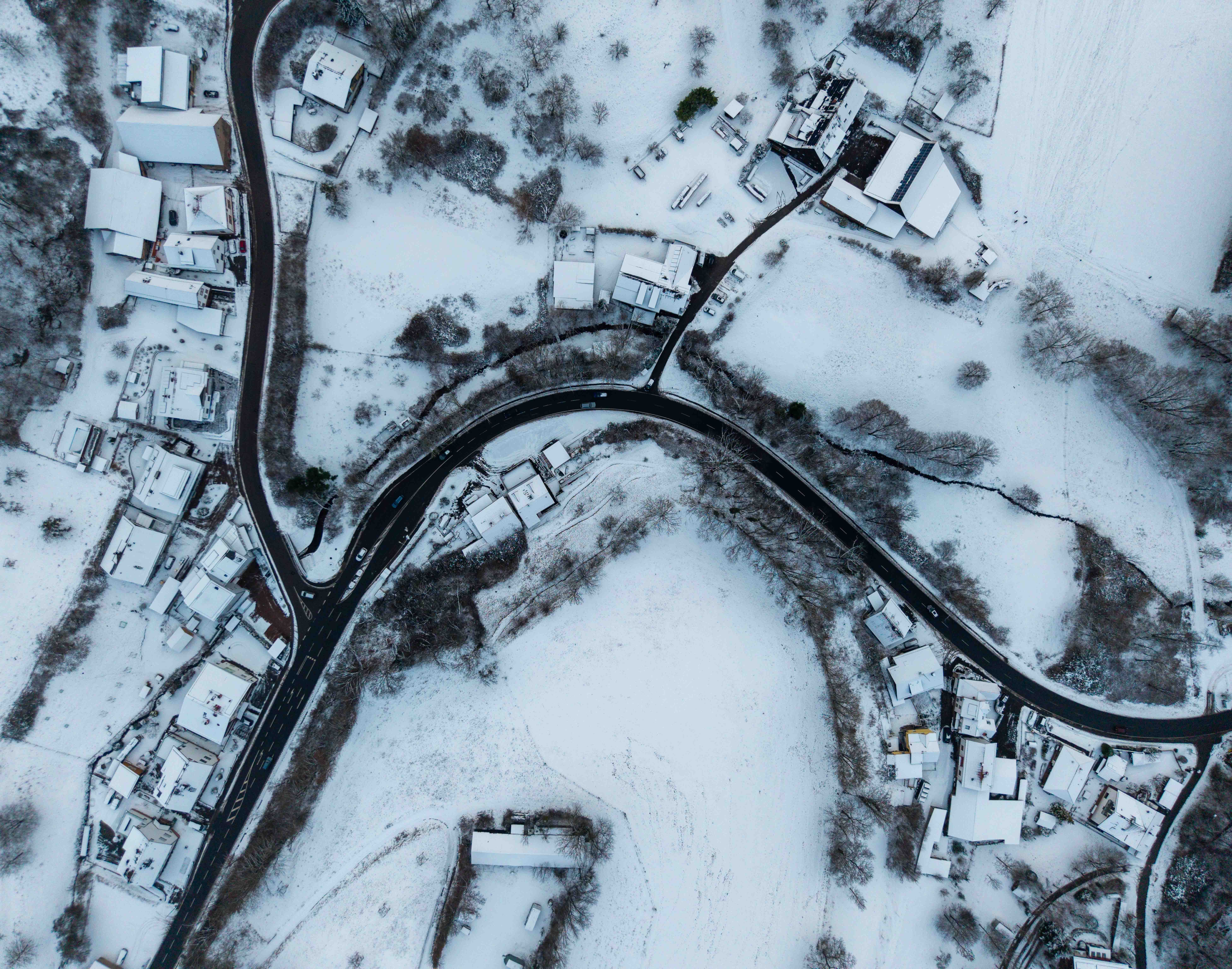 Snowy Aerial View of Rural Winter Landscape · Free Stock Photo