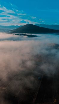 A breathtaking morning view of misty mountains and fog-covered valleys in Bursa, Turkey.