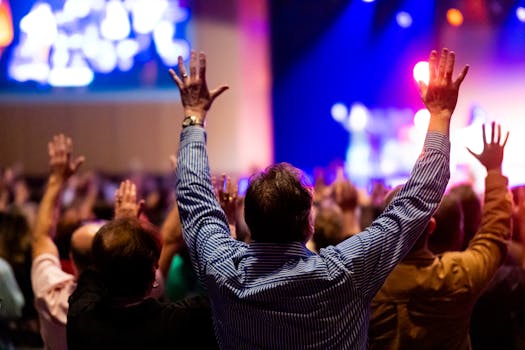 Energizing scene of a crowd enjoying a live music performance with colorful stage lights.