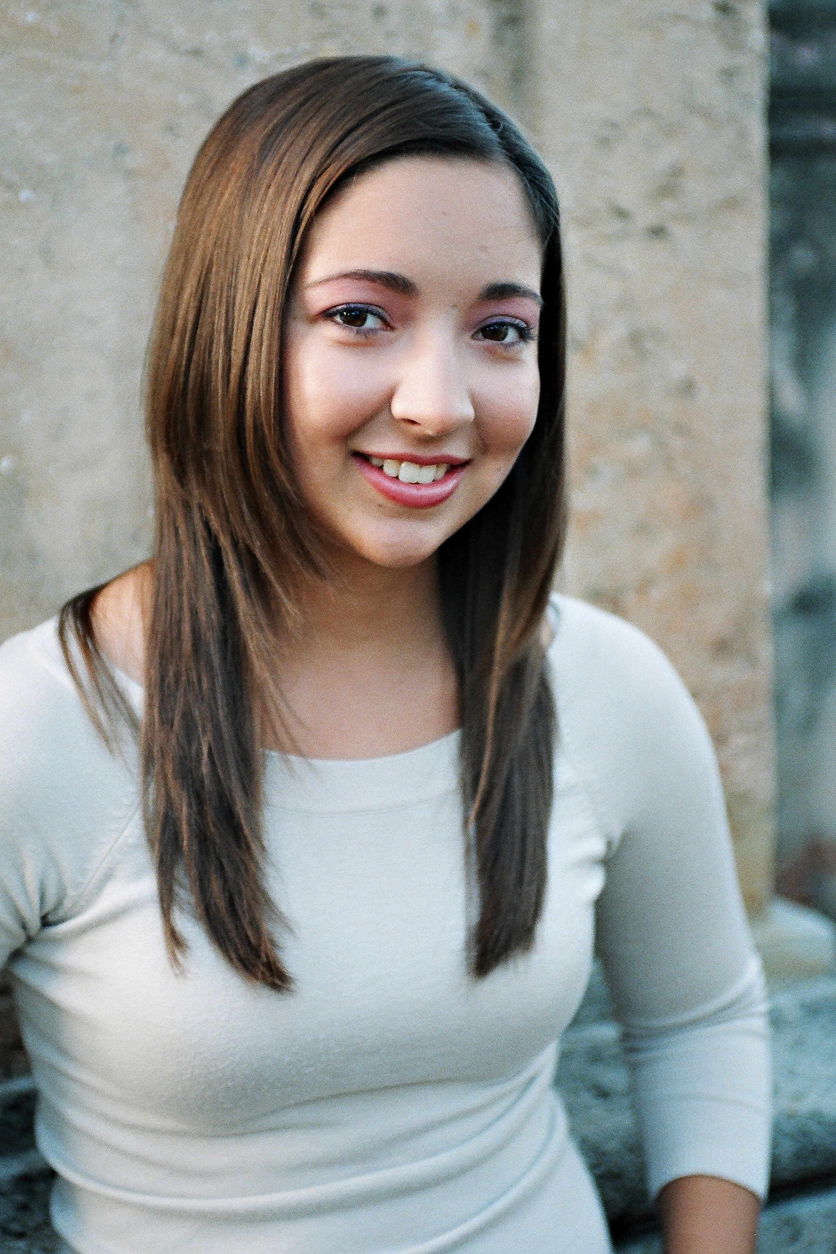 Portrait of a Smiling Young Woman Outdoors · Free Stock Photo