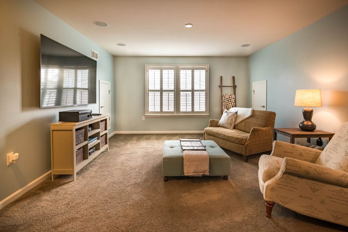 Modern living room with a large television, illustrating home entertainment options for Brampton viewers