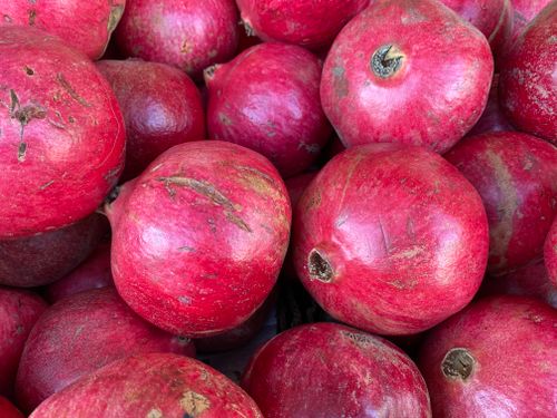 Free Close-up of ripe pomegranates with rich red hues, perfect for healthy eating concepts. Stock Photo