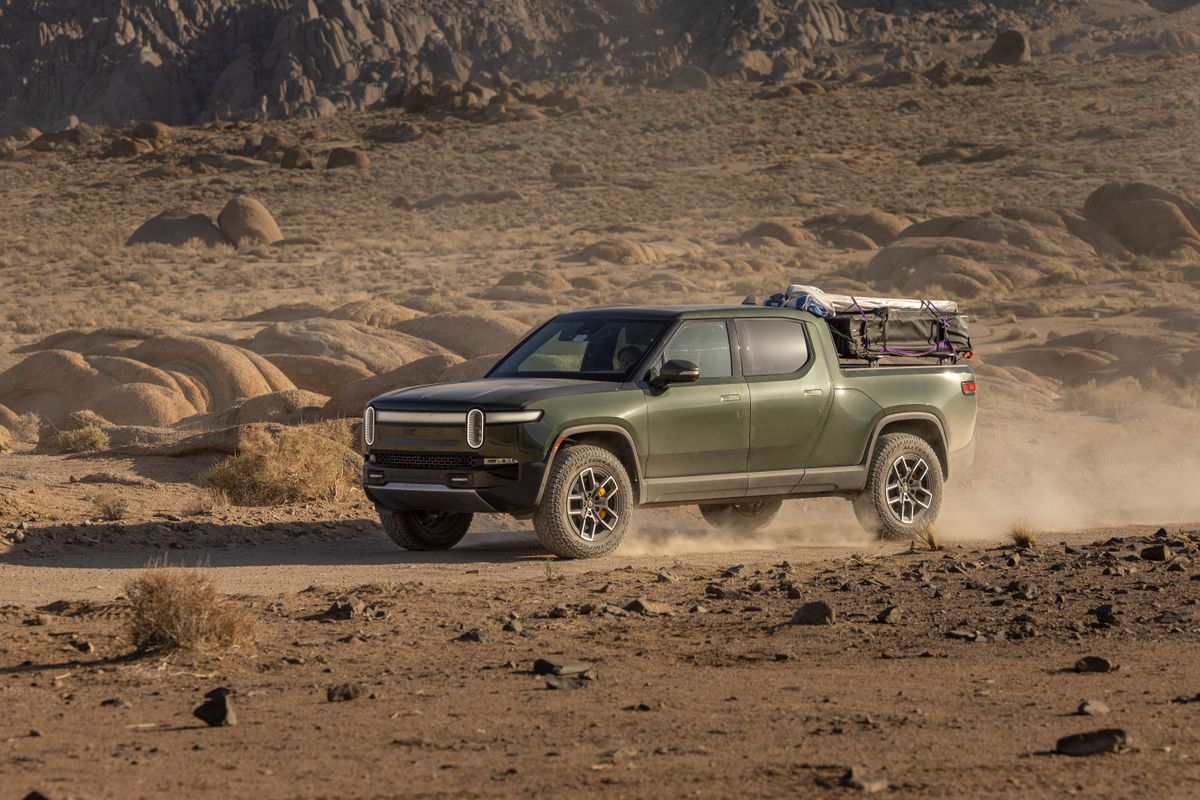 4x4 off-road truck driving desert trail with aired-down tires for improved traction on loose terrain