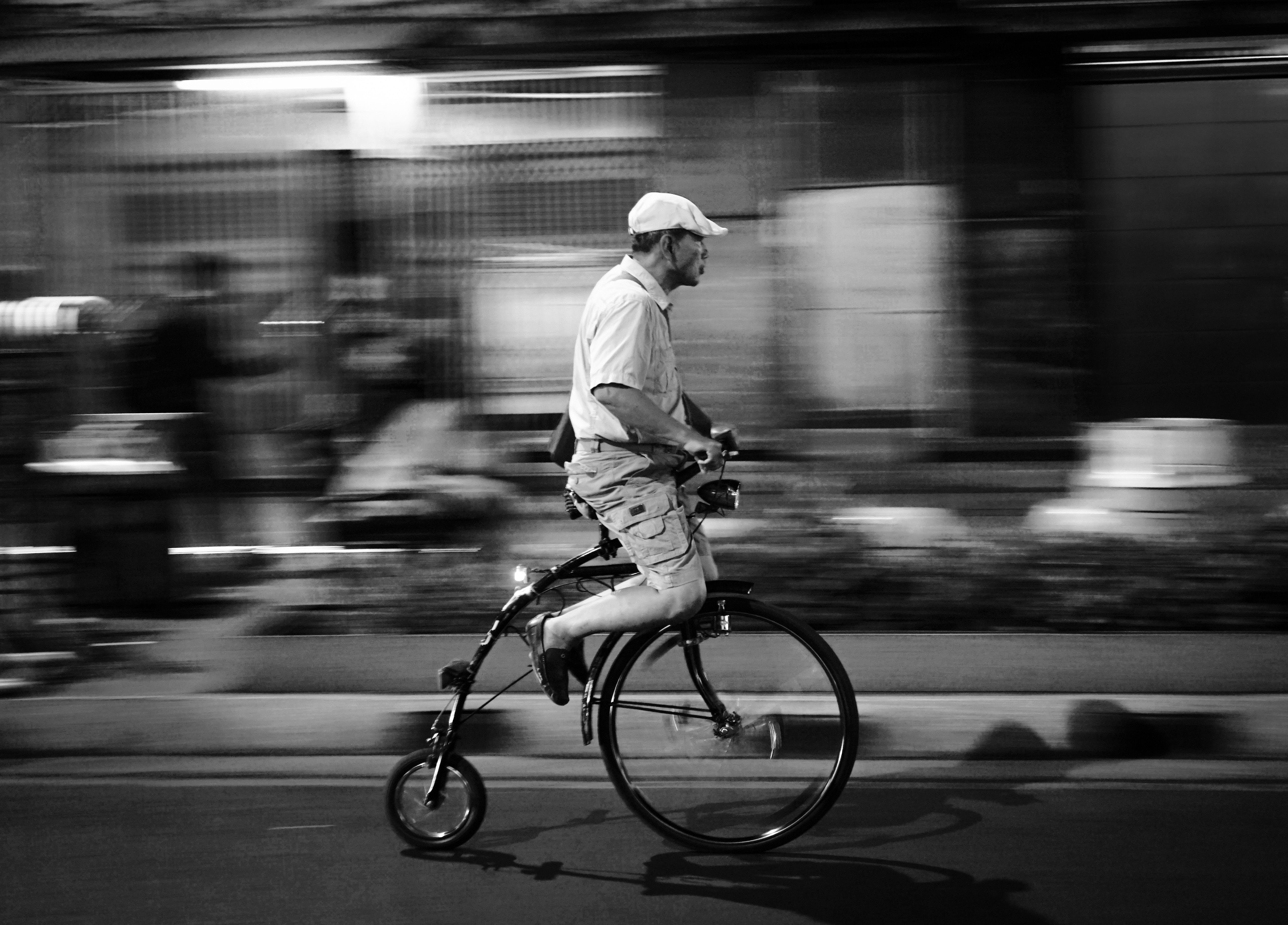 Man Riding Bicycle in Motion Blur at Night · Free Stock Photo