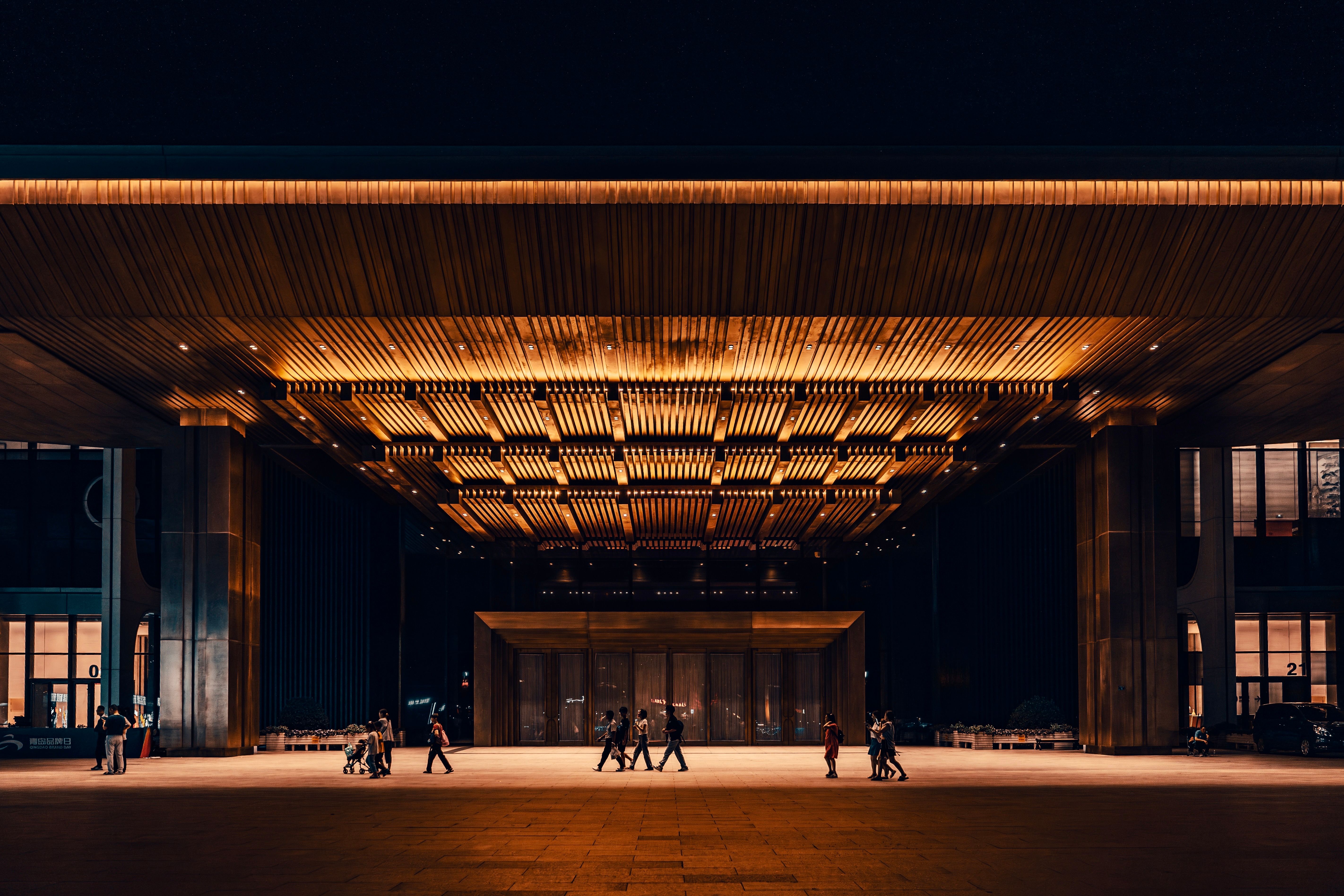 Modern Building Entrance at Night with Warm Lighting · Free Stock Photo