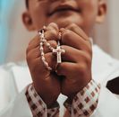 Boy Holding Rosary