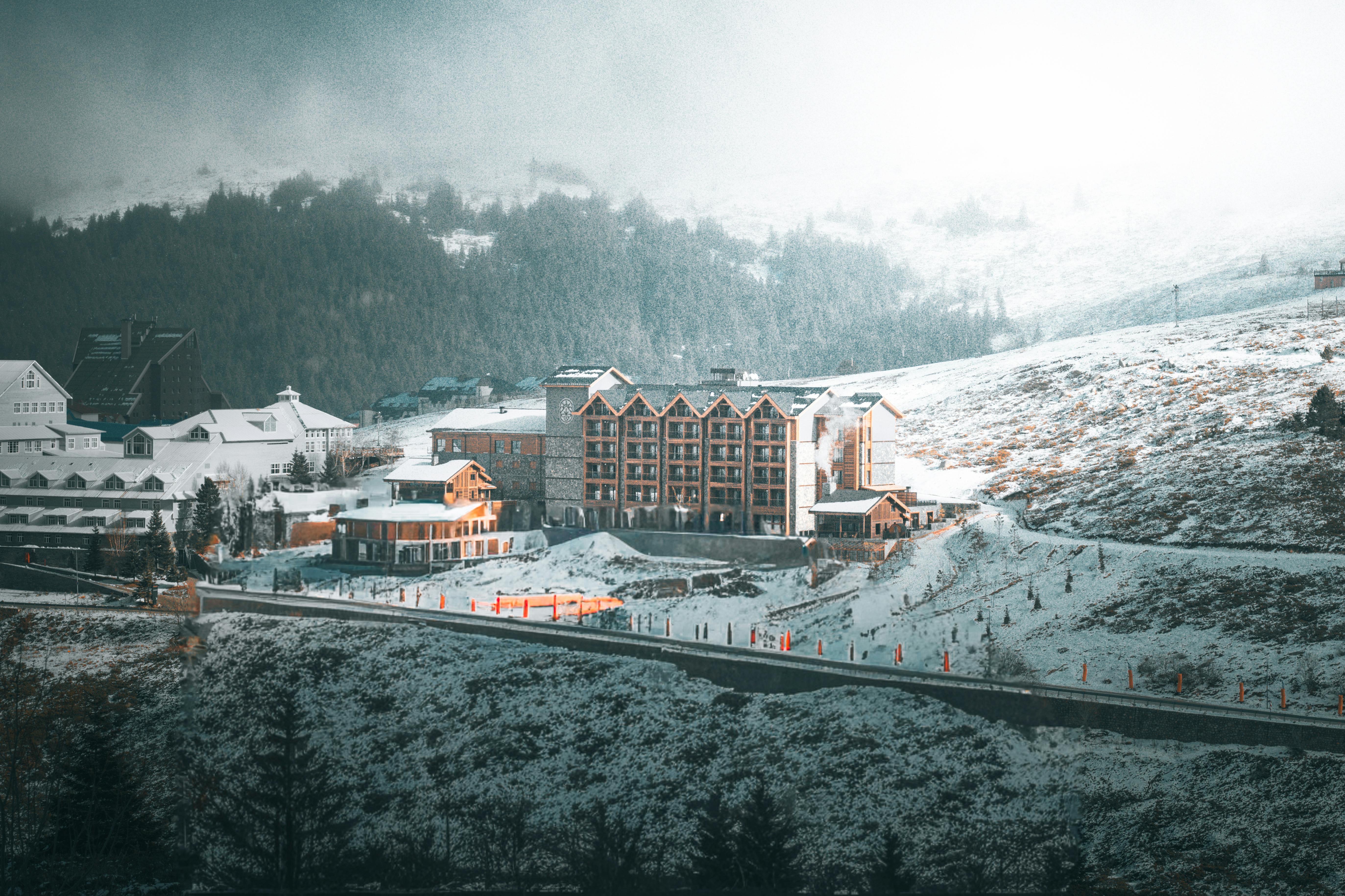 Charming mountain resort nestled in a snowy landscape, perfect for a winter getaway.