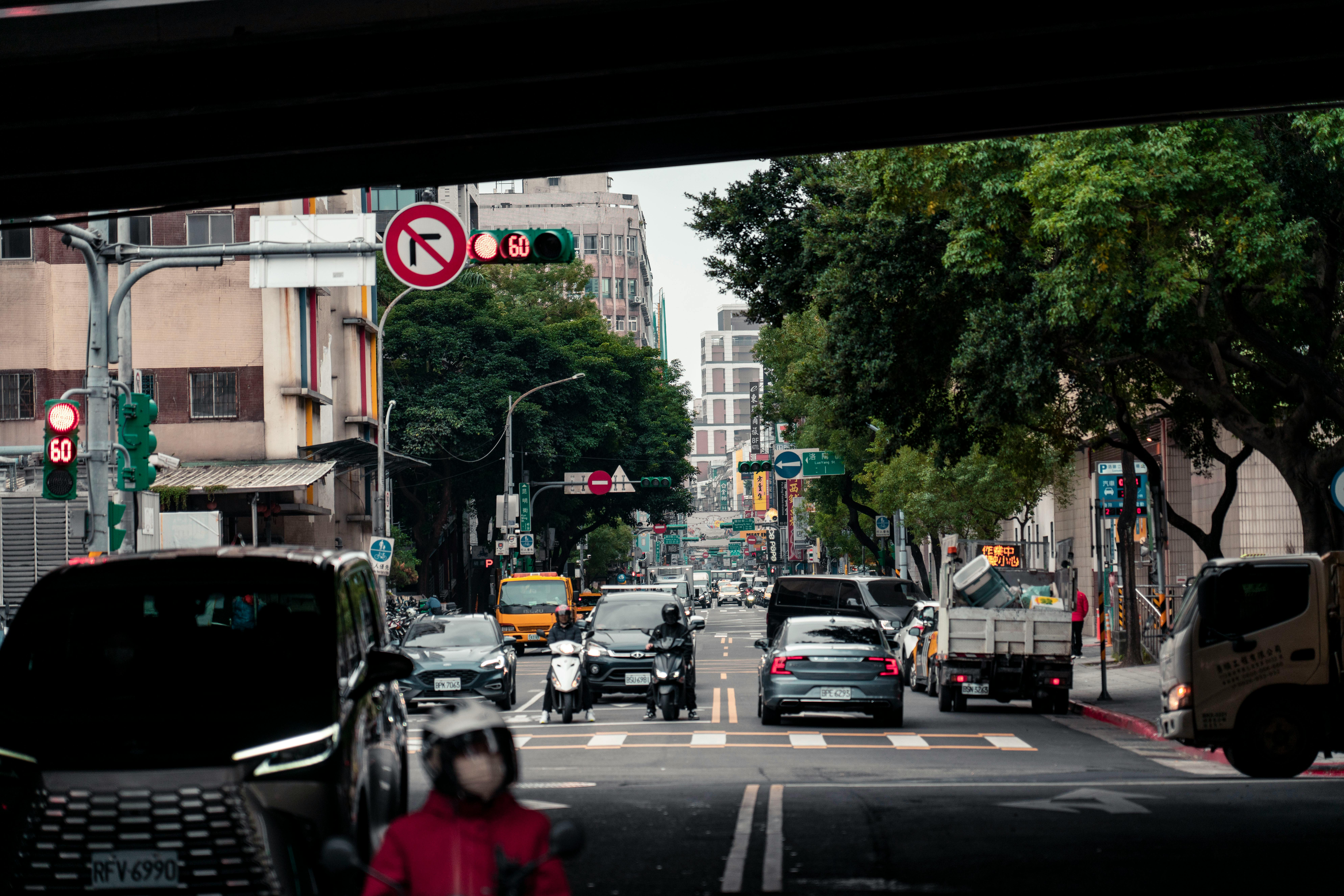 What should you do if you are turning left and a bike is crossing the intersection from the opposite direction