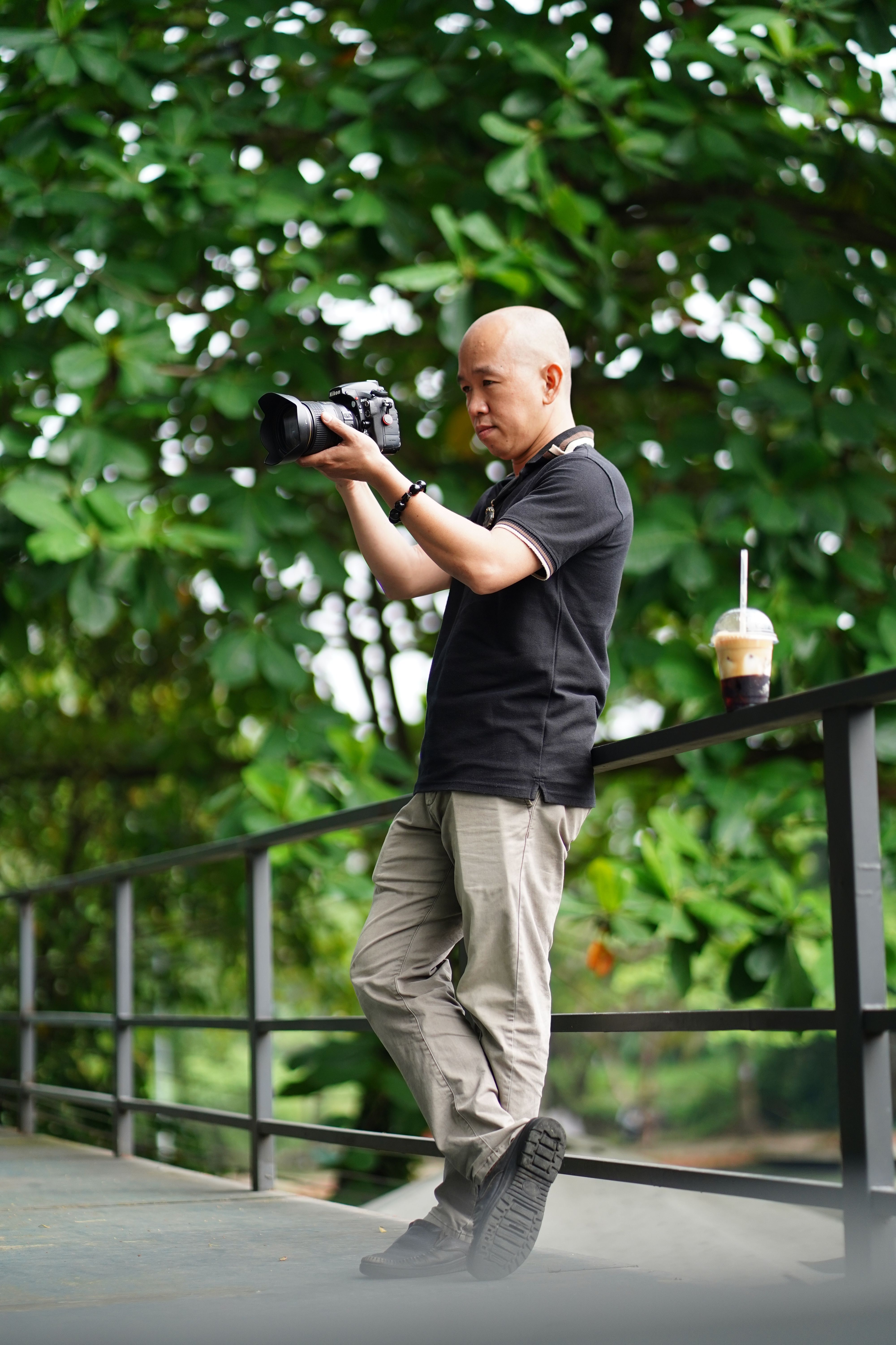 Outdoor scene of a photographer capturing nature with professional equipment.