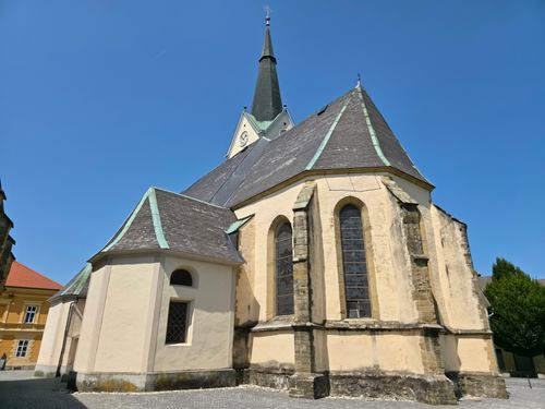 Free Gothic church architecture in Prevalje, Slovenia against clear blue sky. Stock Photo