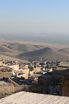 Breathtaking aerial view of Mardin's unique cityscape and surrounding landscapes in Turkey.