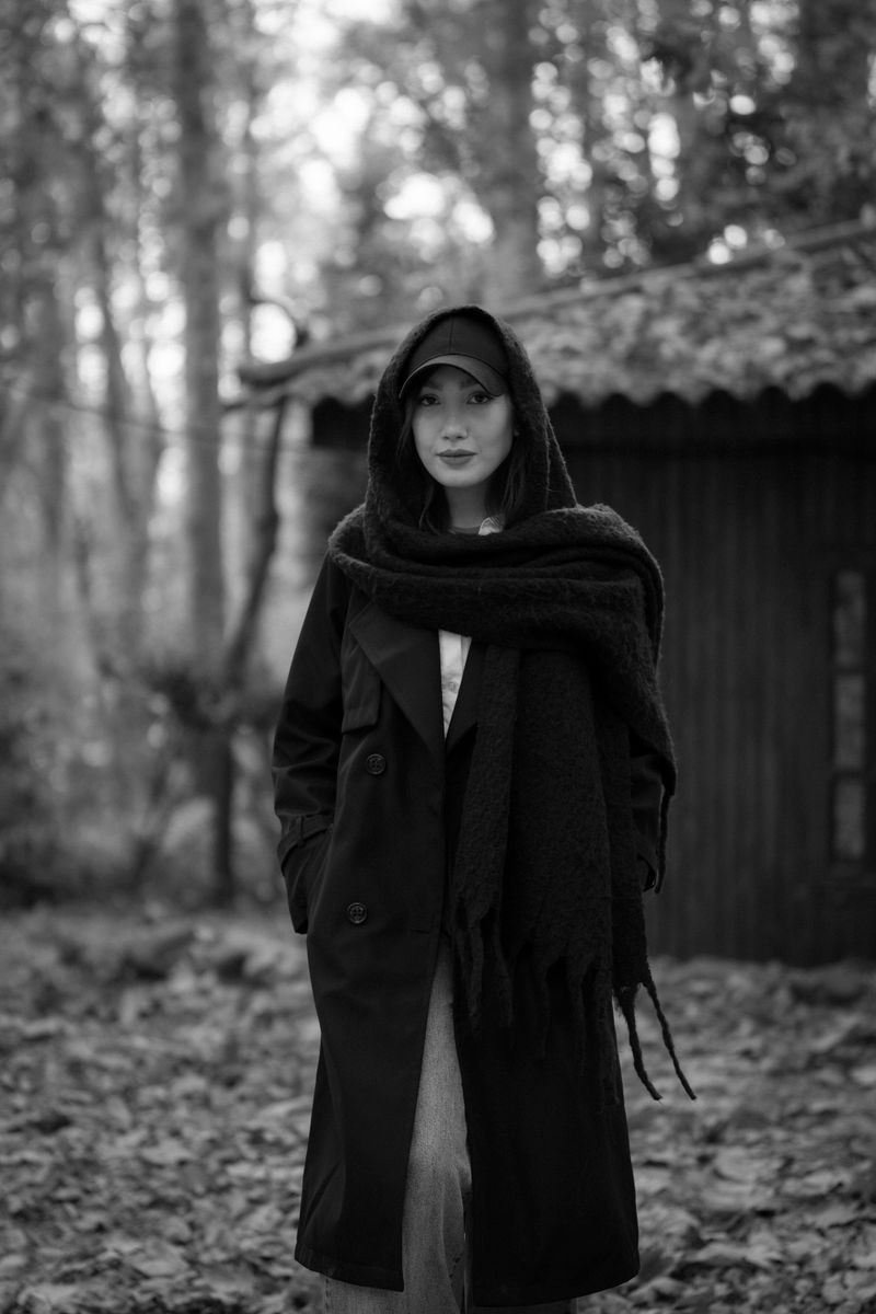 woman in trench coat with faux fur collar scarf