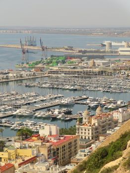 A stunning aerial view of Alicante's marina and coastline with numerous yachts.
