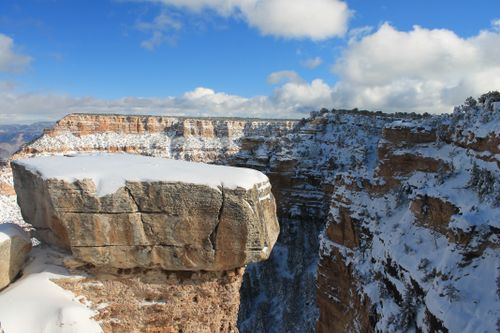 Free Stunning winter view of snow-dusted cliffs at the Grand Canyon. Stock Photo