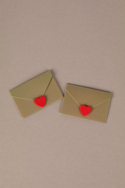 Free Two golden envelopes with red heart seals on a neutral background. Perfect for love themes. Stock Photo