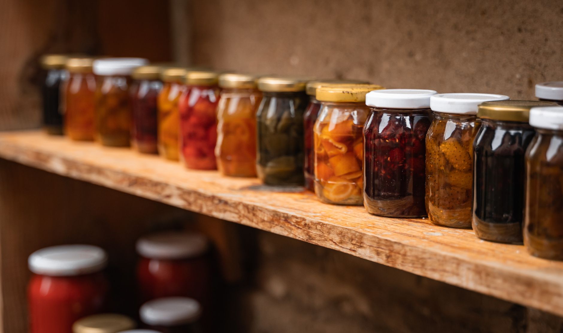 small airtight glass jars for saffron storage in a dark cupboard