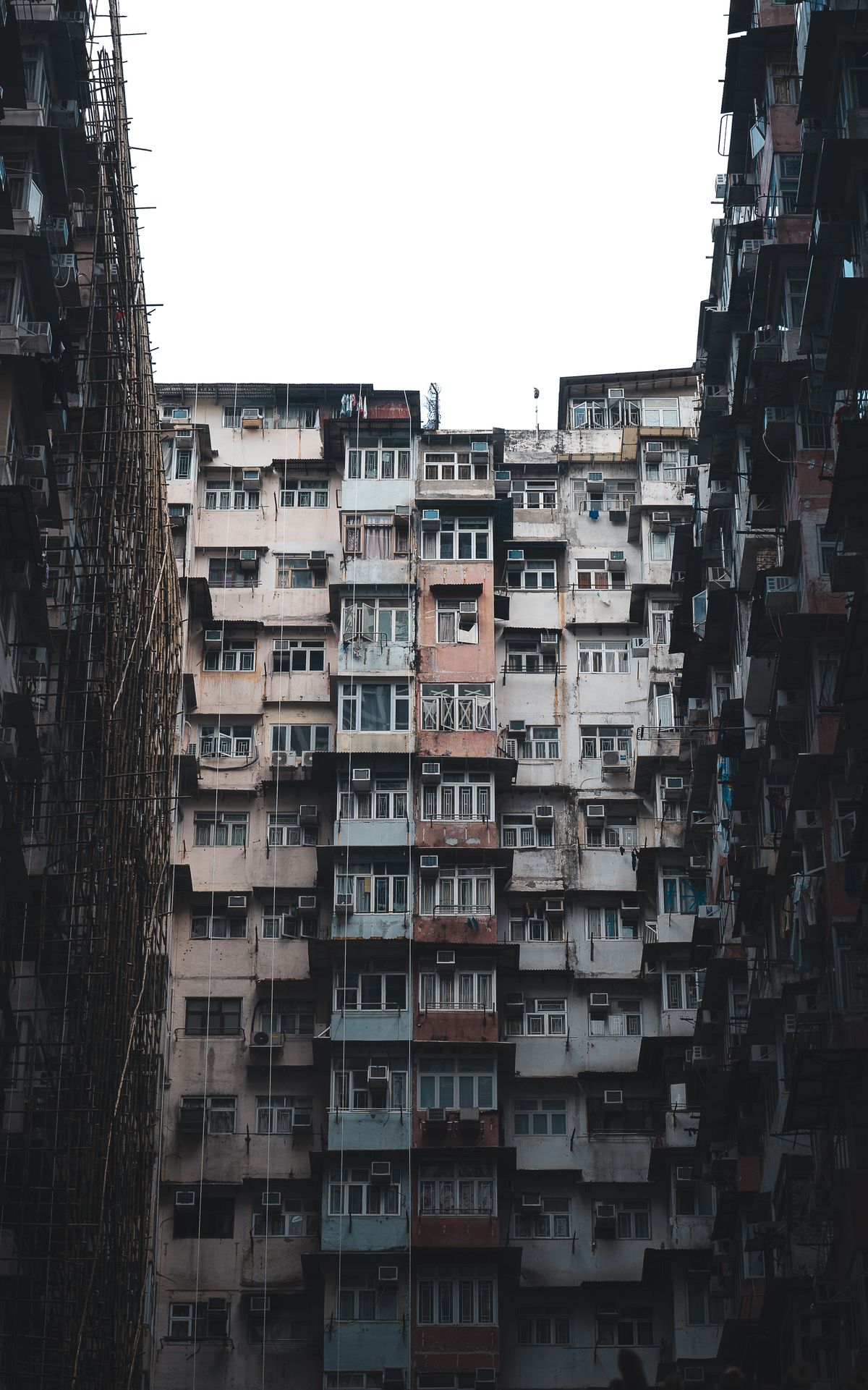 Wall of high-rise apartment towers filling the frame in Hong Kong