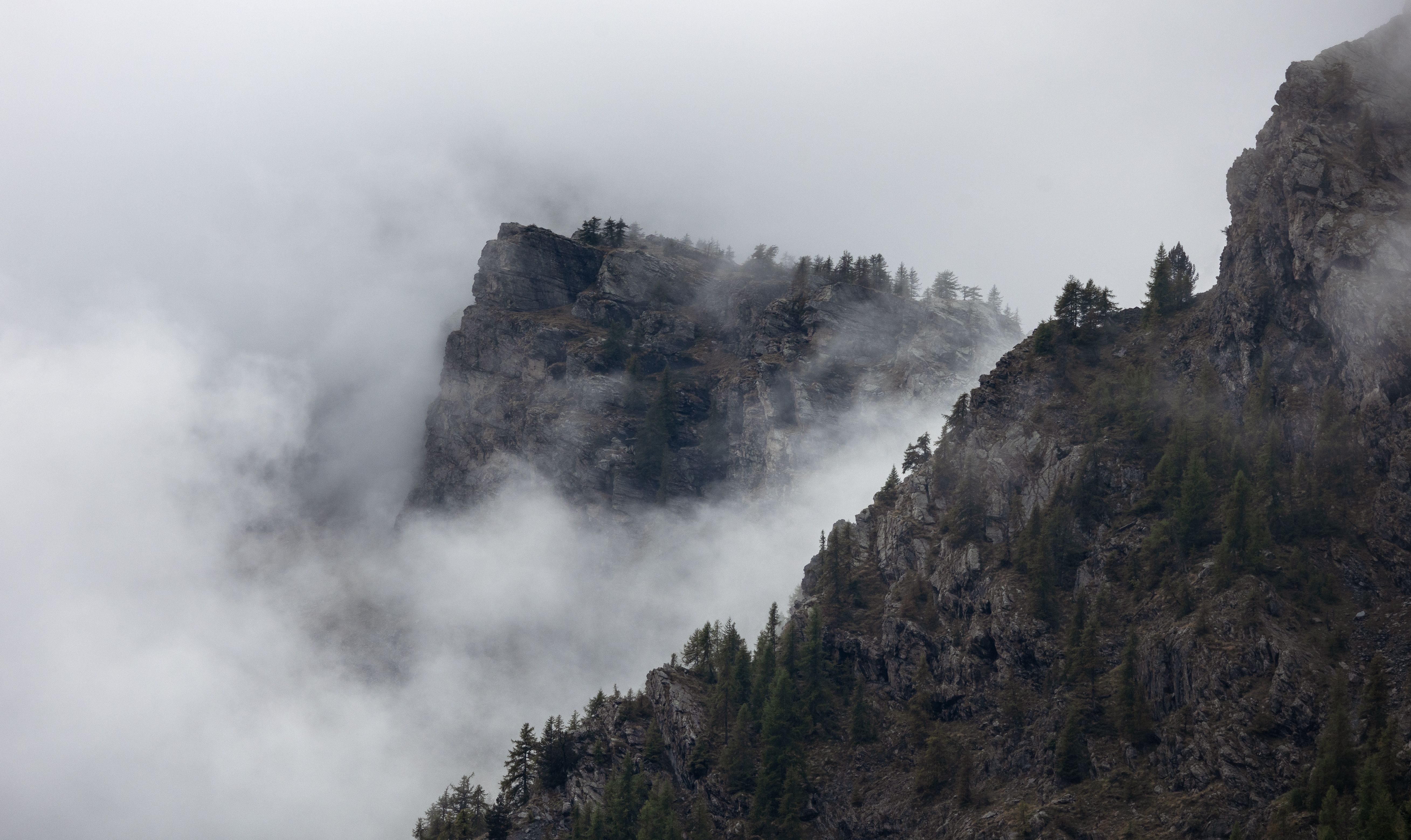 Moody Mountain Peaks Shrouded in Mist · Free Stock Photo