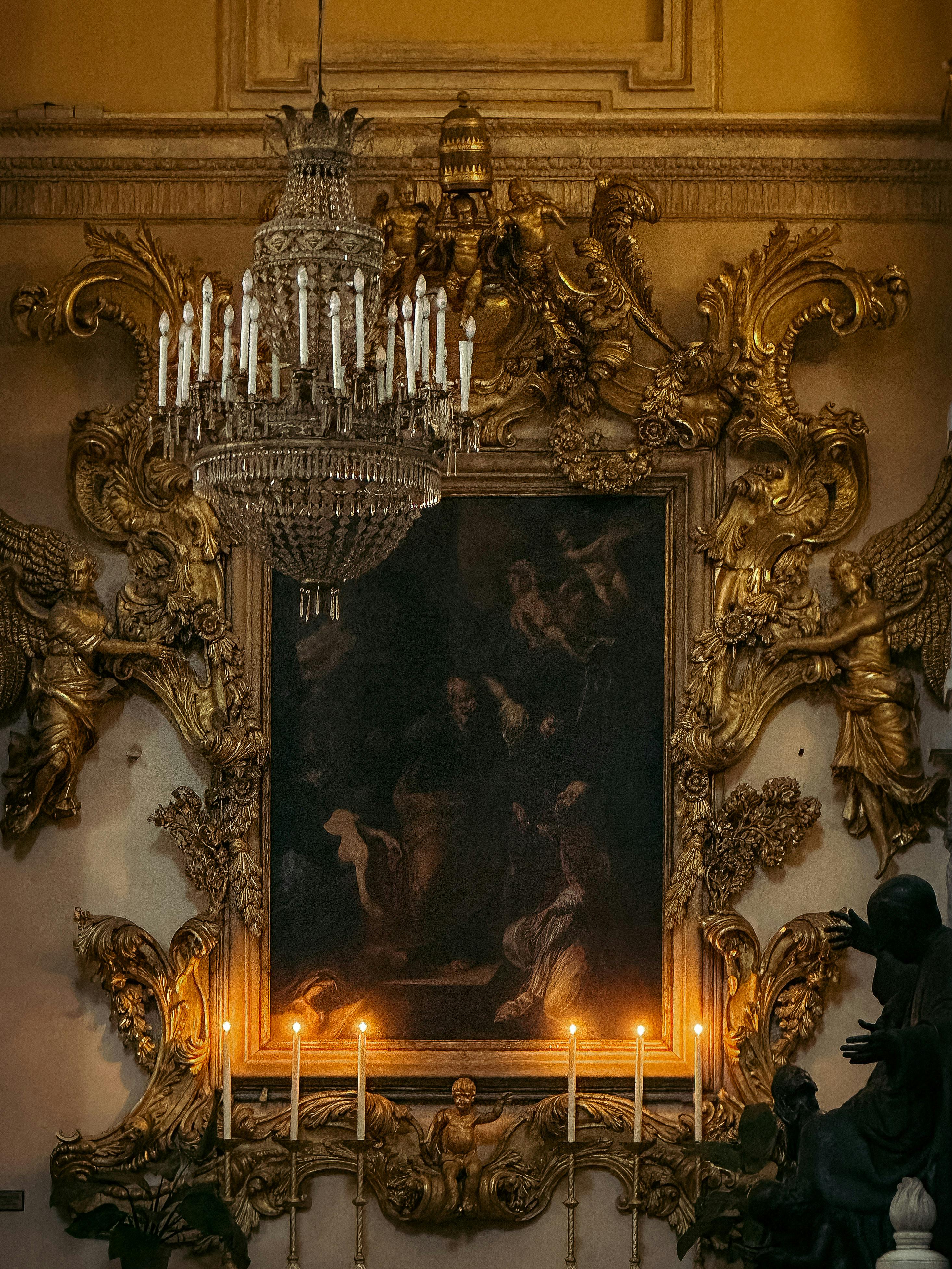Elegant Baroque-style room with golden decorations and a chandelier in Catania, Sicily.