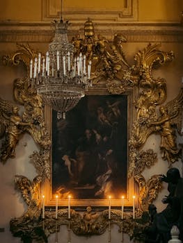 Elegant Baroque-style room with golden decorations and a chandelier in Catania, Sicily.