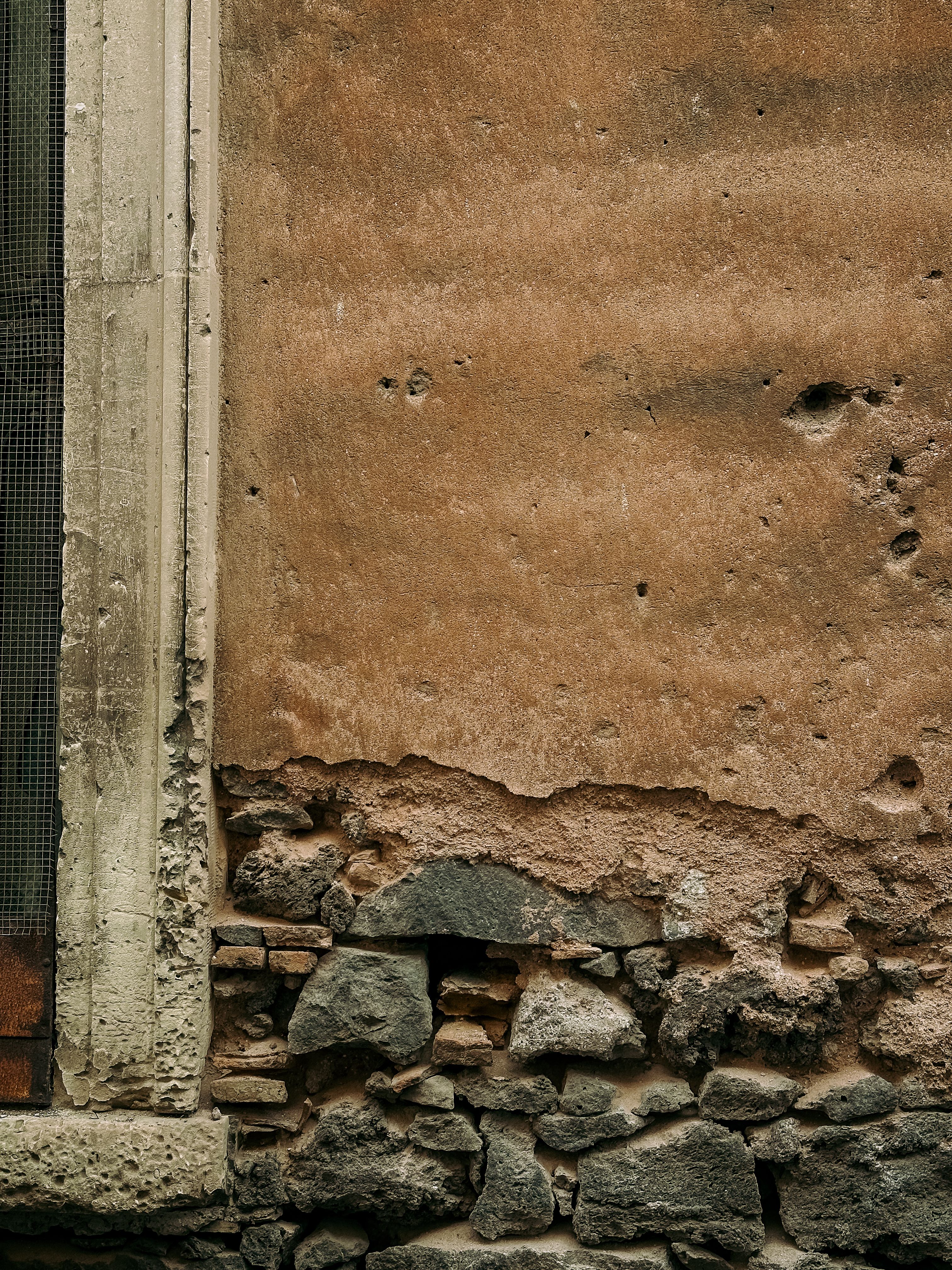 Rustic Stone and Plaster Wall in Catania, Sicily · Free Stock Photo