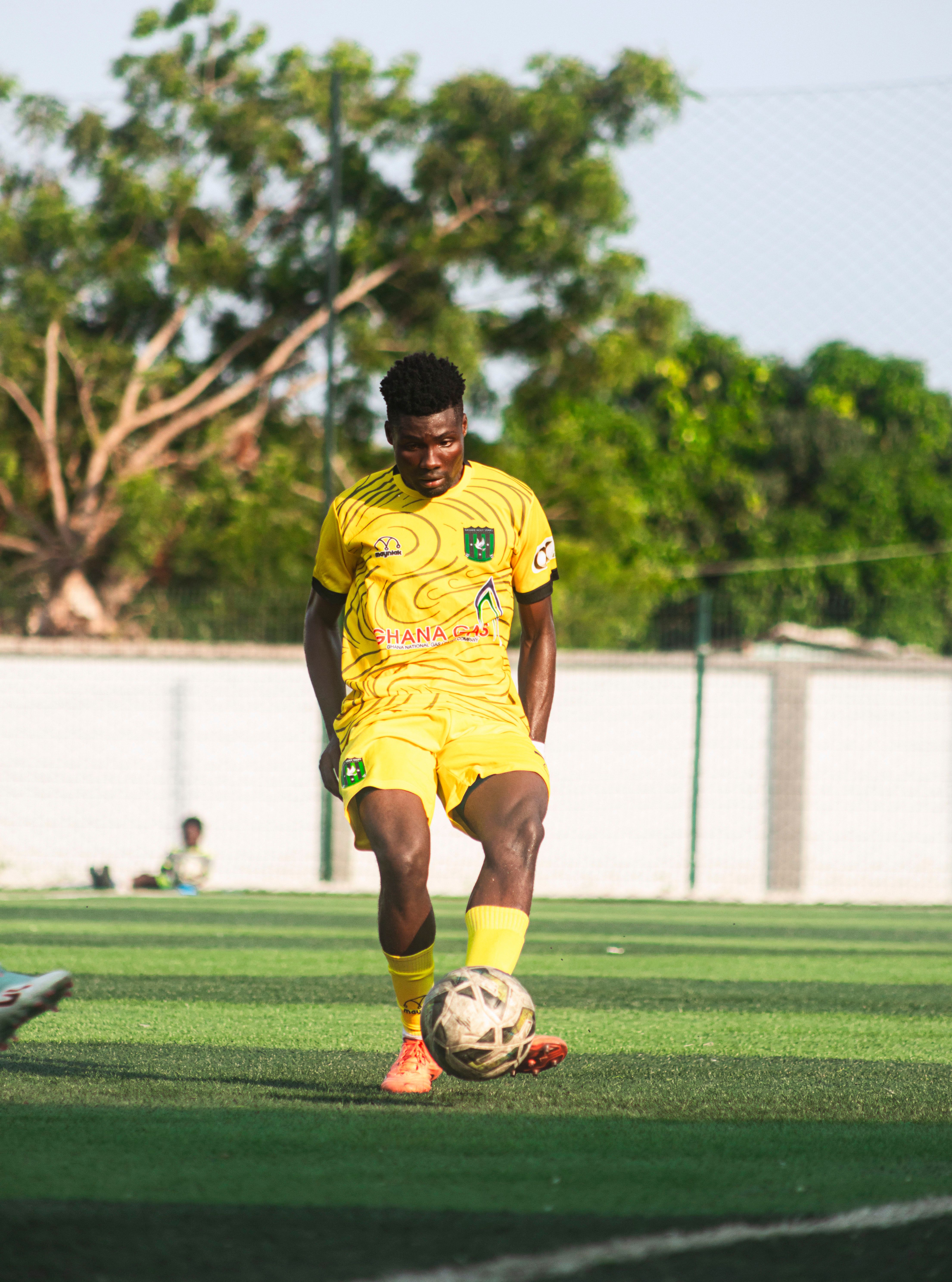 Soccer Player Practicing on Outdoor Field · Free Stock Photo