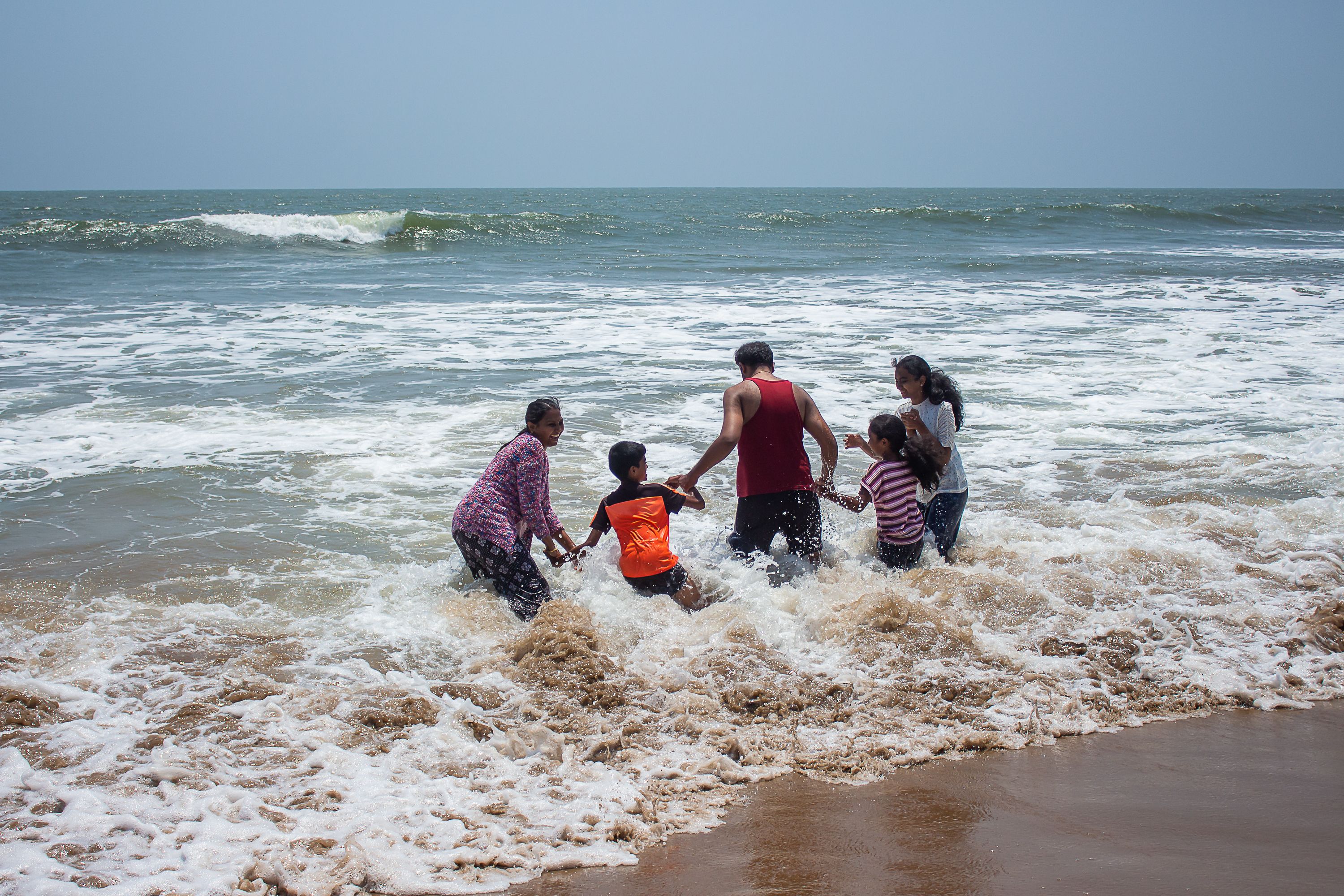 Family Enjoying a Fun Day at the Beach · Free Stock Photo