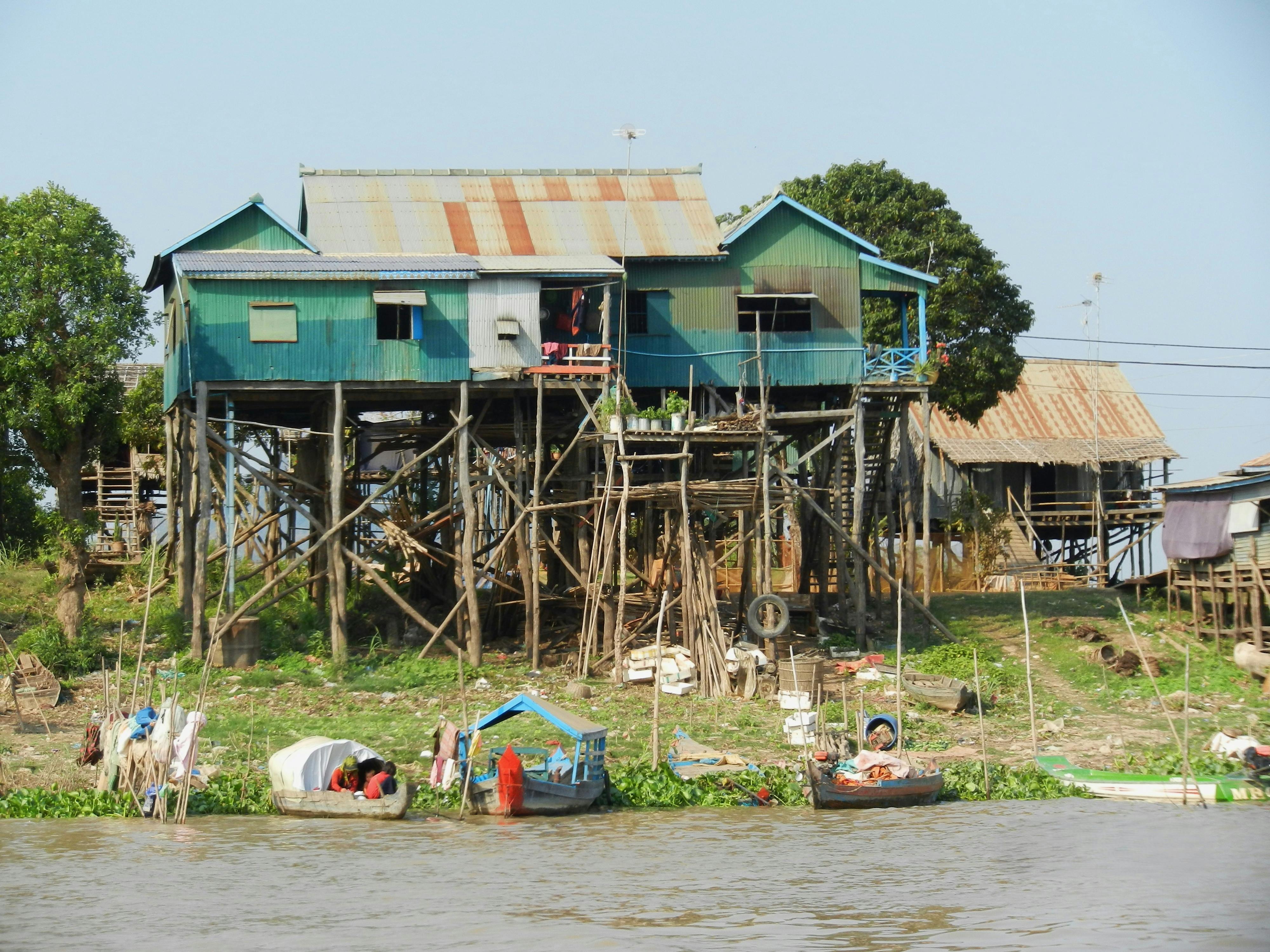 Stilt Houses by a River in Rural Cambodia · Free Stock Photo