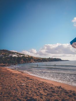 Enjoy a sunny day at a serene beach in Annaba, with rolling waves and clear skies.