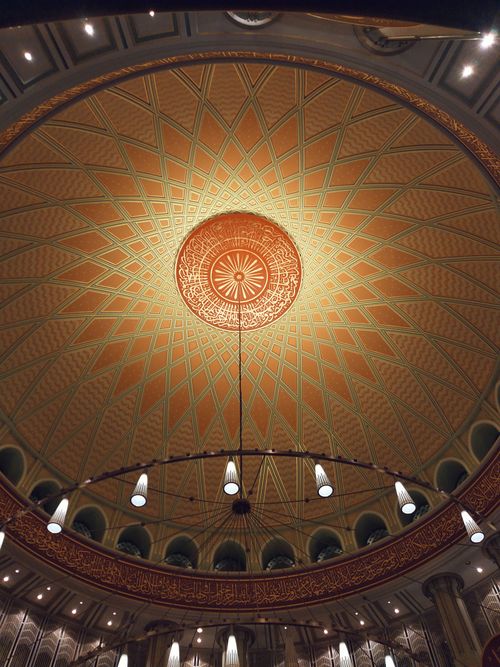 Free Captivating view of an ornate dome ceiling featuring intricate geometric patterns and decorative lighting. Stock Photo